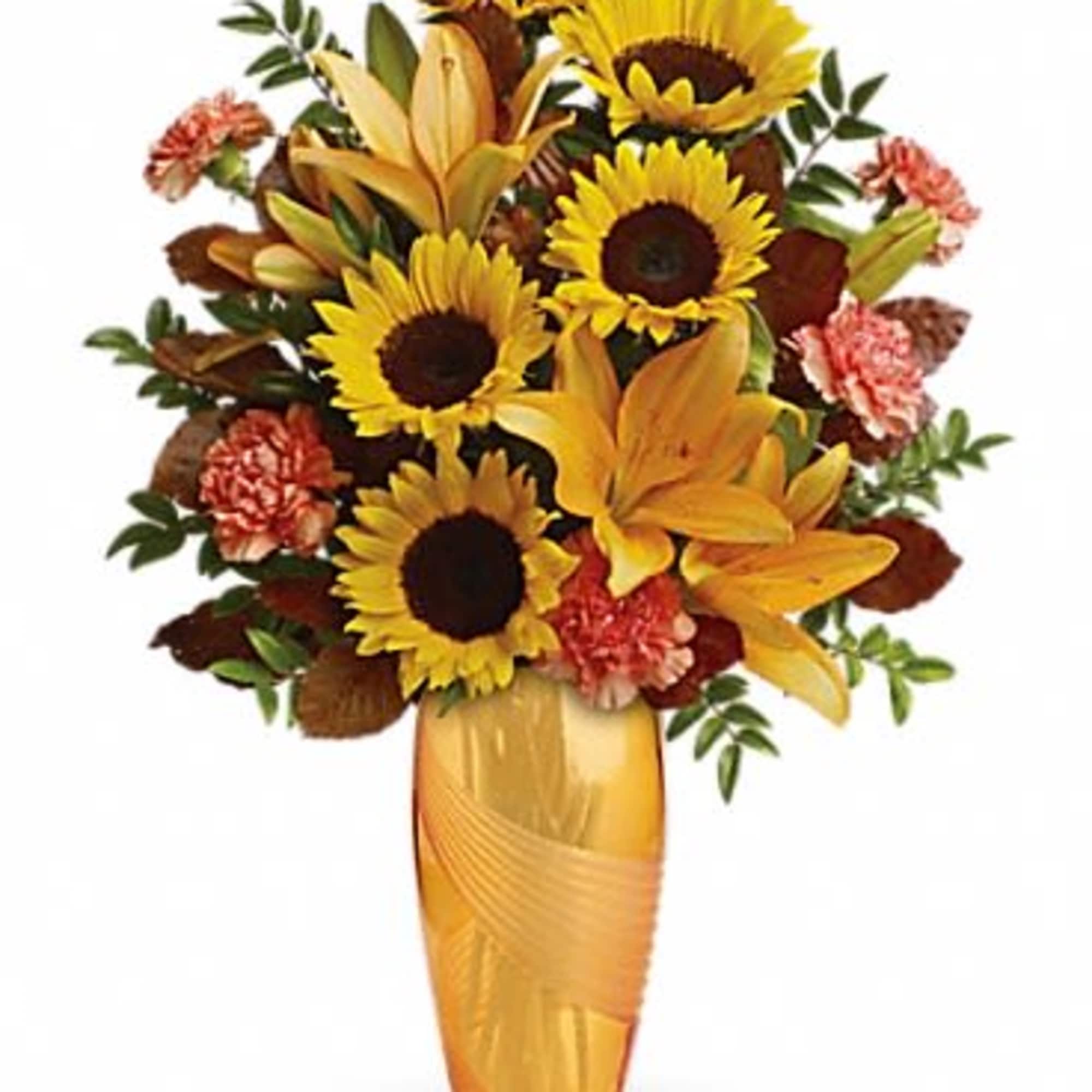 Bright yellow sunflowers and golden-orange lilies give this flower arrangement an immediate