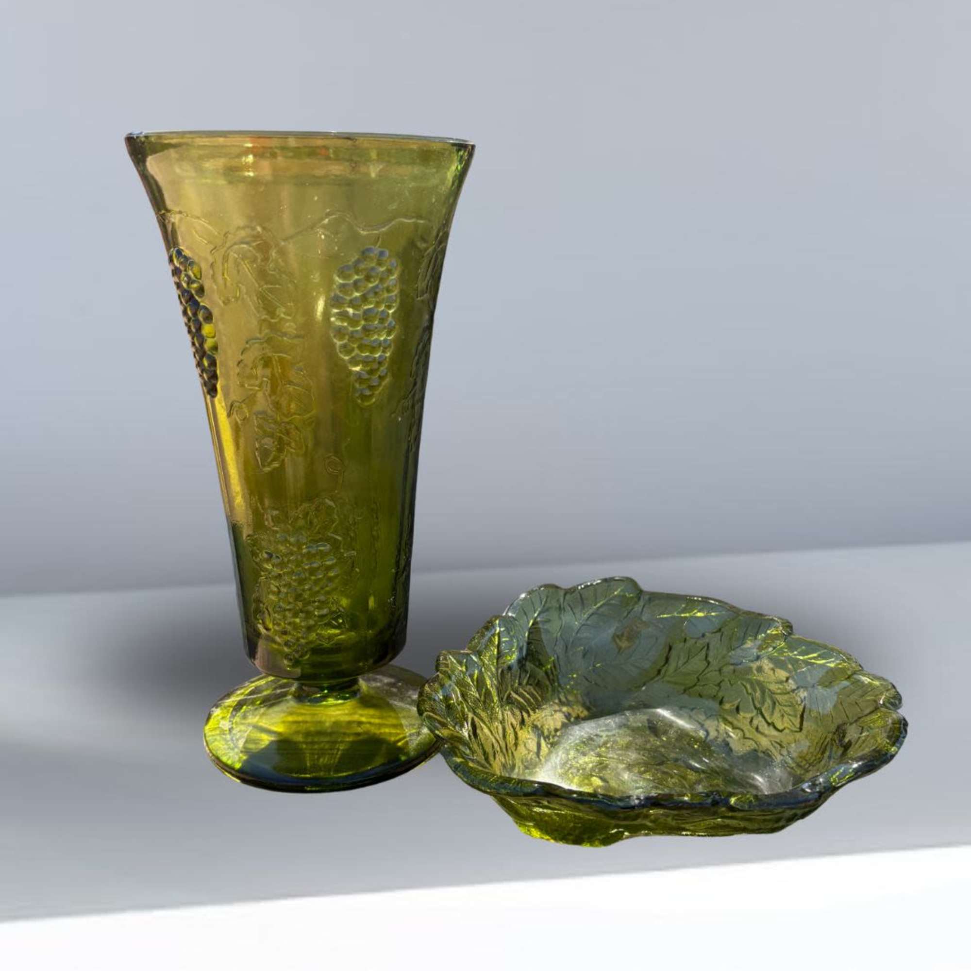 Beautiful vintage green glass vase featuring an elegant etched grape and vine