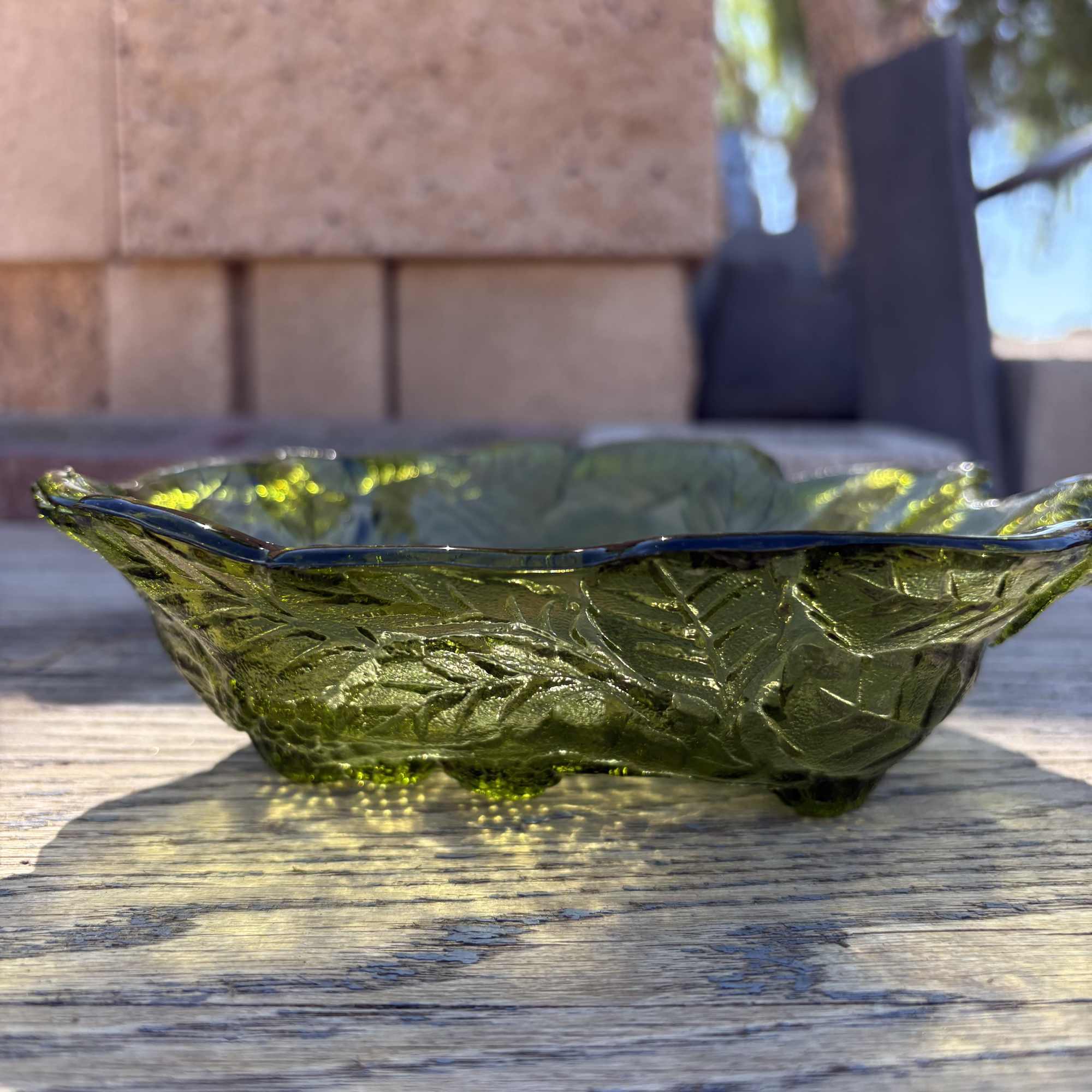 Beautiful vintage green glass vase featuring an elegant etched grape and vine