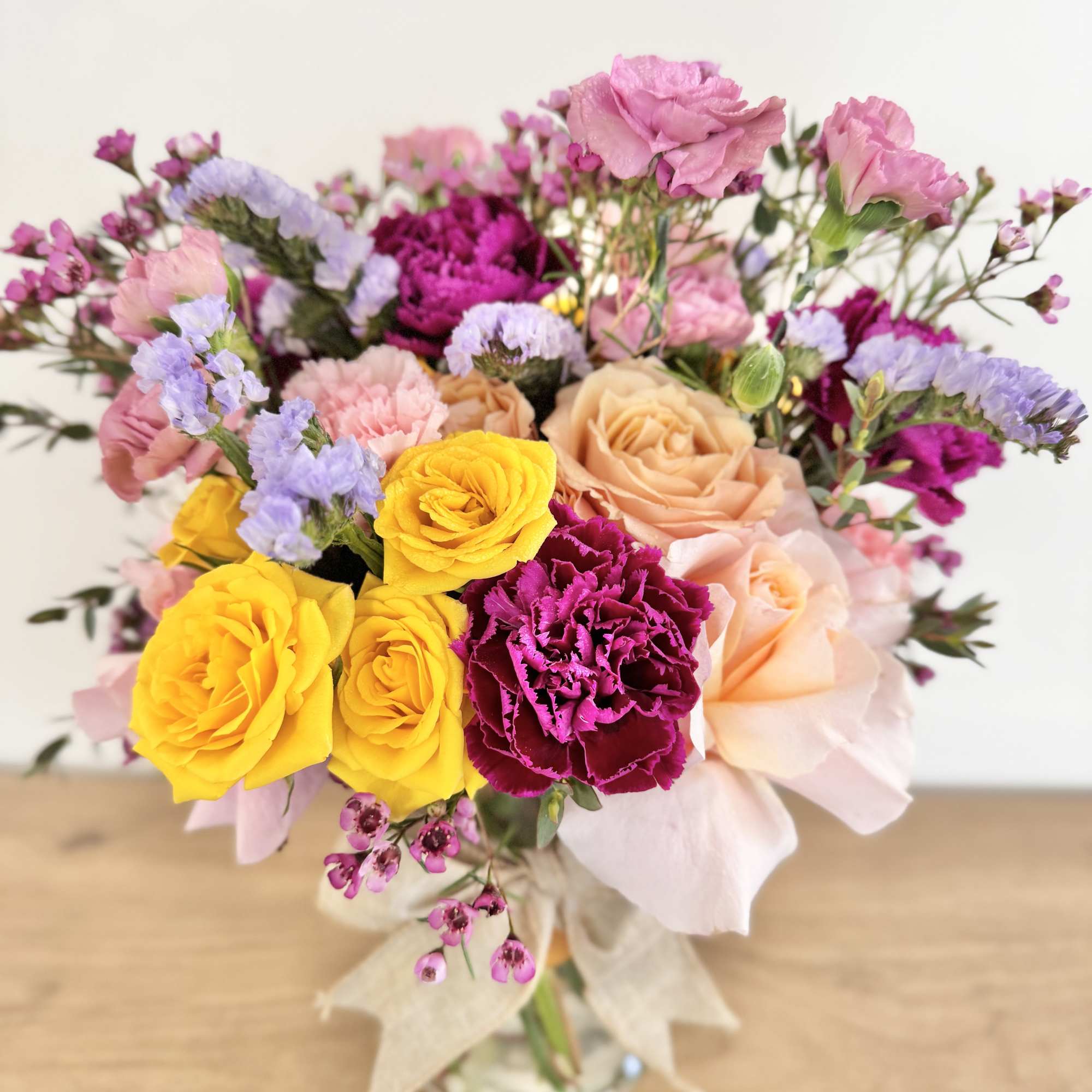 A one-of-a-kind arrangement designed with the freshest seasonal blooms, thoughtfully crafted to