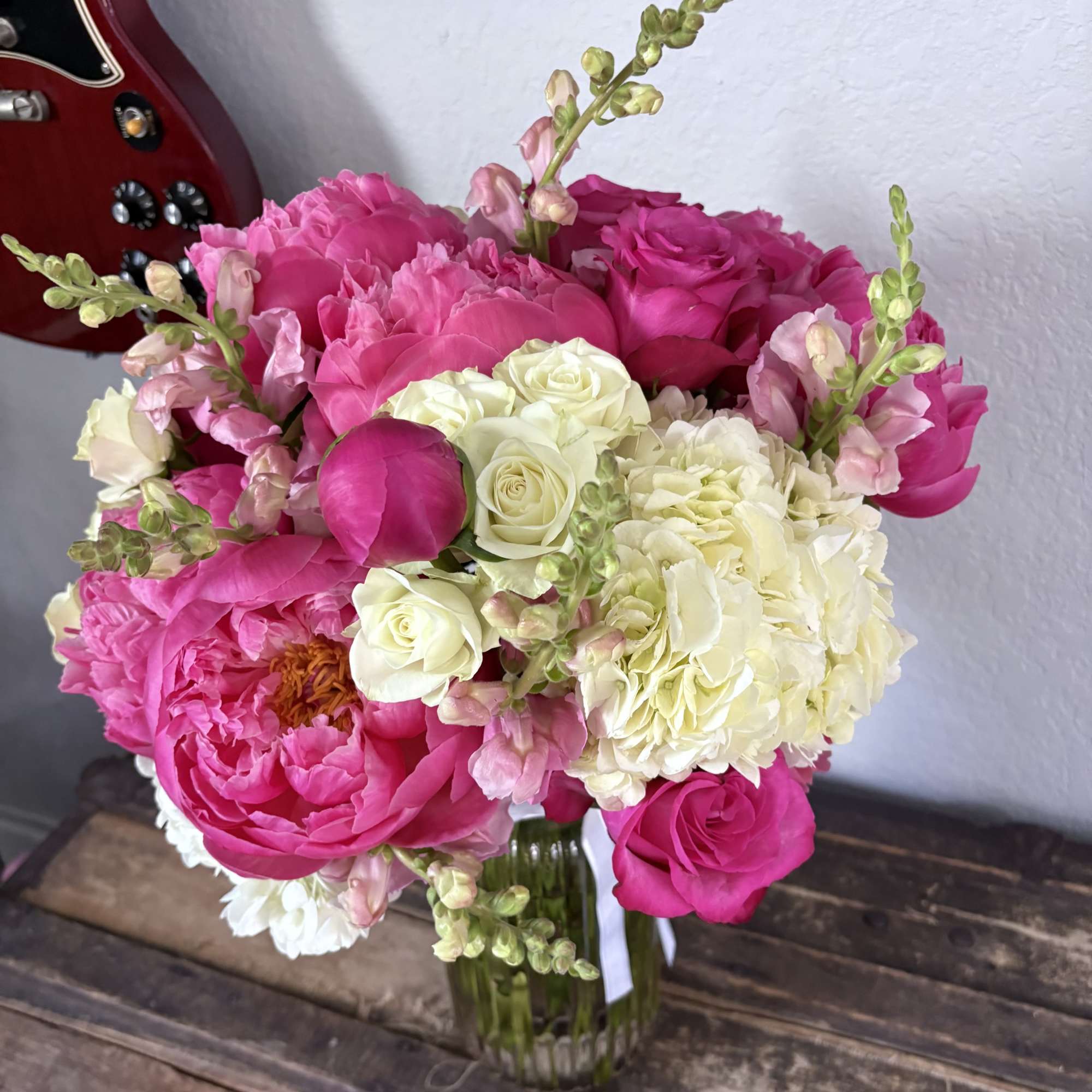 Pink and white flower bouquet in a glass vase