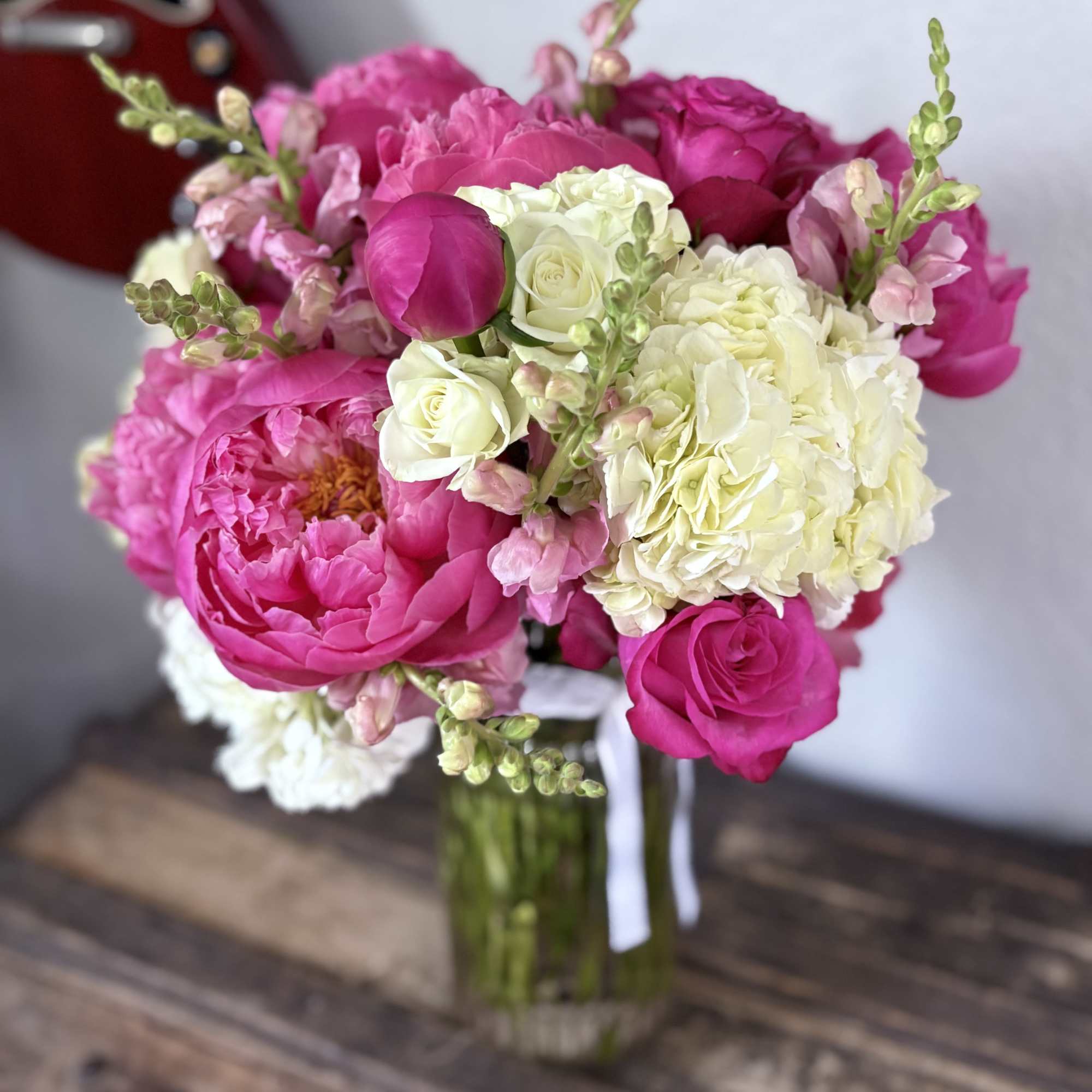 Pink and white bouquet in a glass vase