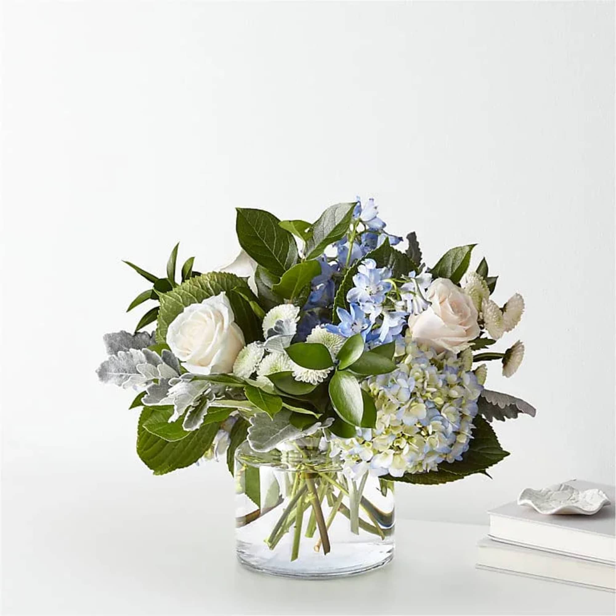 Let this uplifting arrangement be reminders of the clear skies ahead. Capturing