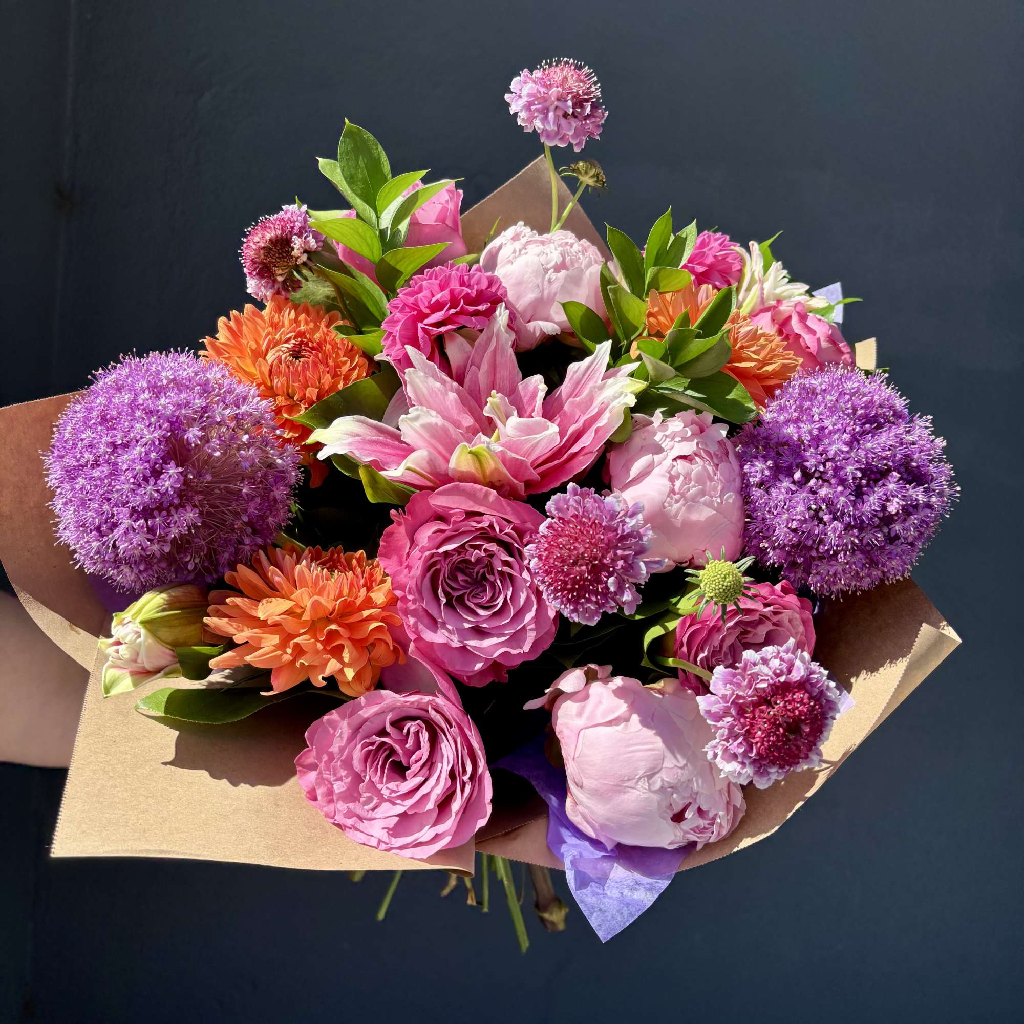Weekly seasonal arrangement that showcases local flowers like peony, dahlias, and allium.