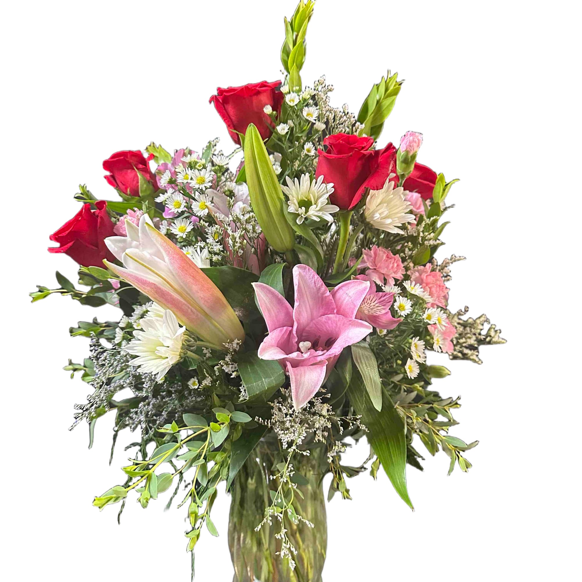 Mix of pink and white flowers including lilies and roses
