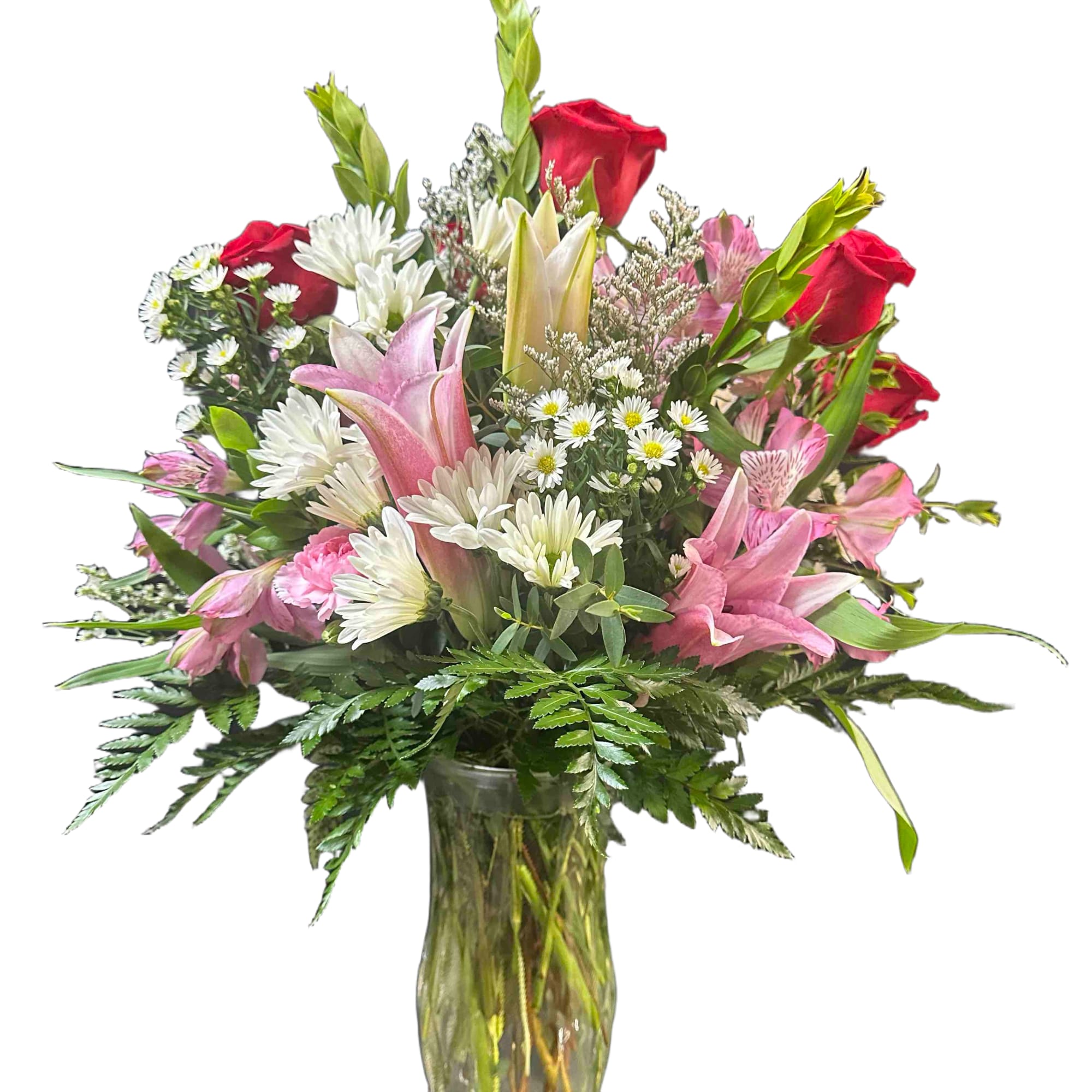 Mix of pink and white flowers including lilies and roses