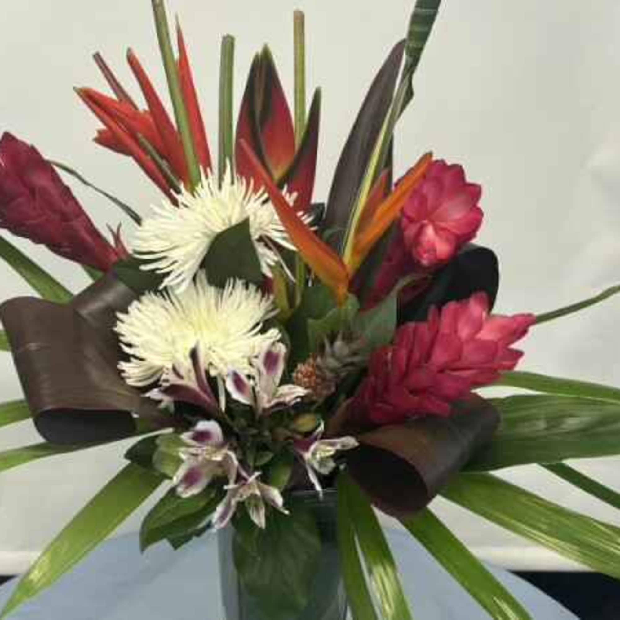 Bold, vertical tropical flair makes this flower arrangement a show-stopping choice for