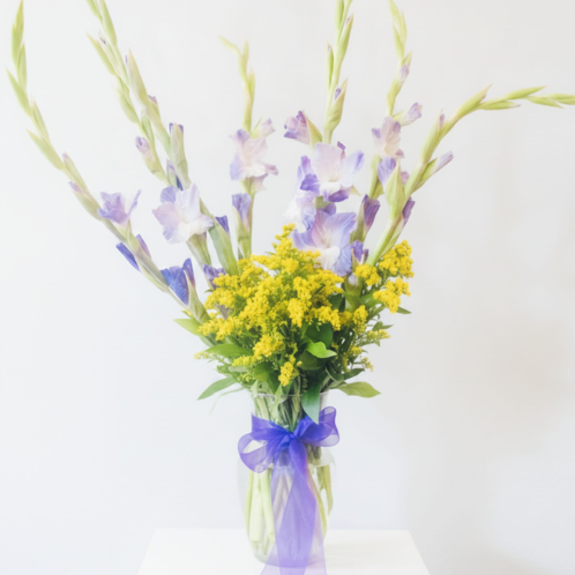 Lift their spirits with tall, airy gladiolus and delicate lavender-and-white blooms that