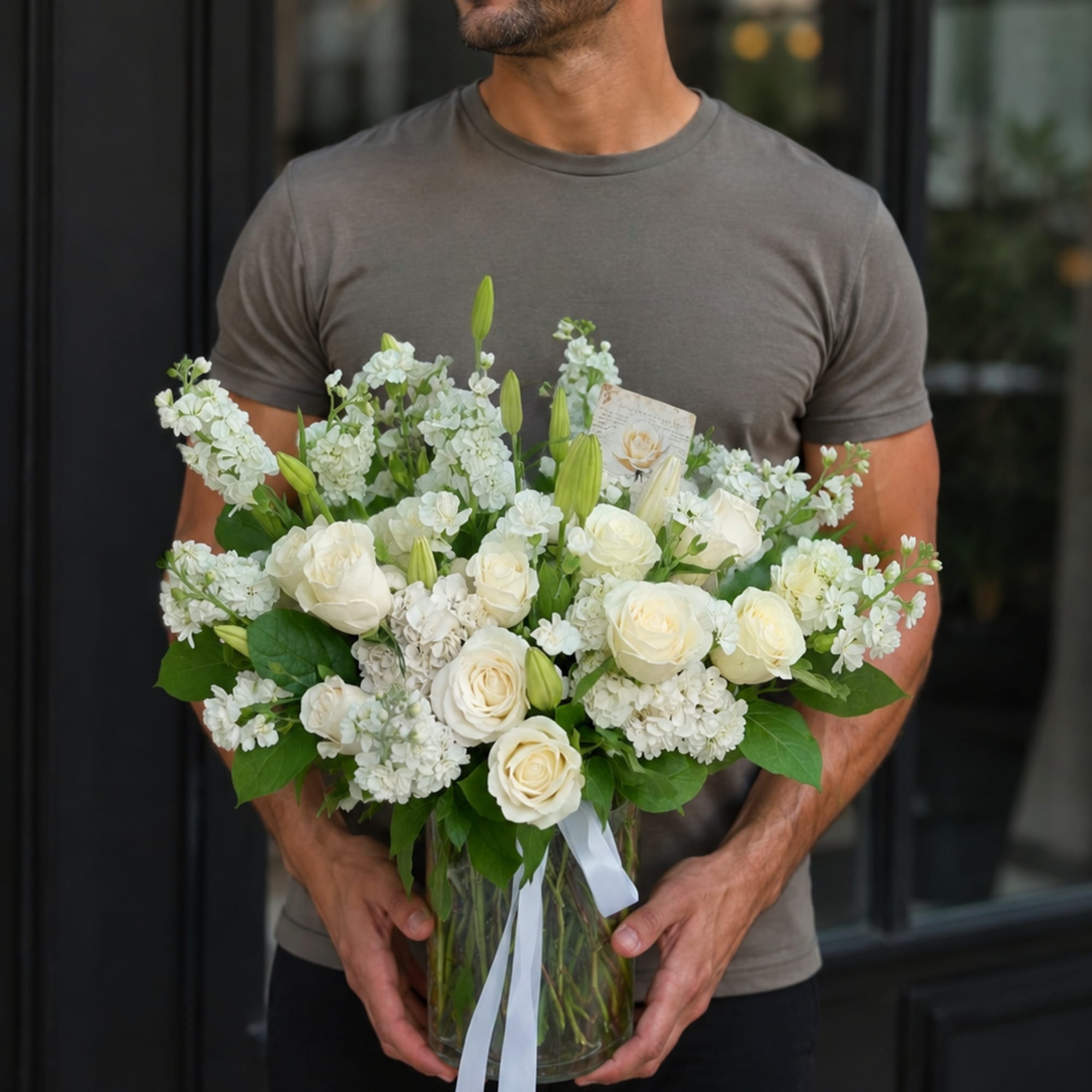 A graceful all-white arrangement crafted for sympathy and funeral moments, Angel Elegance