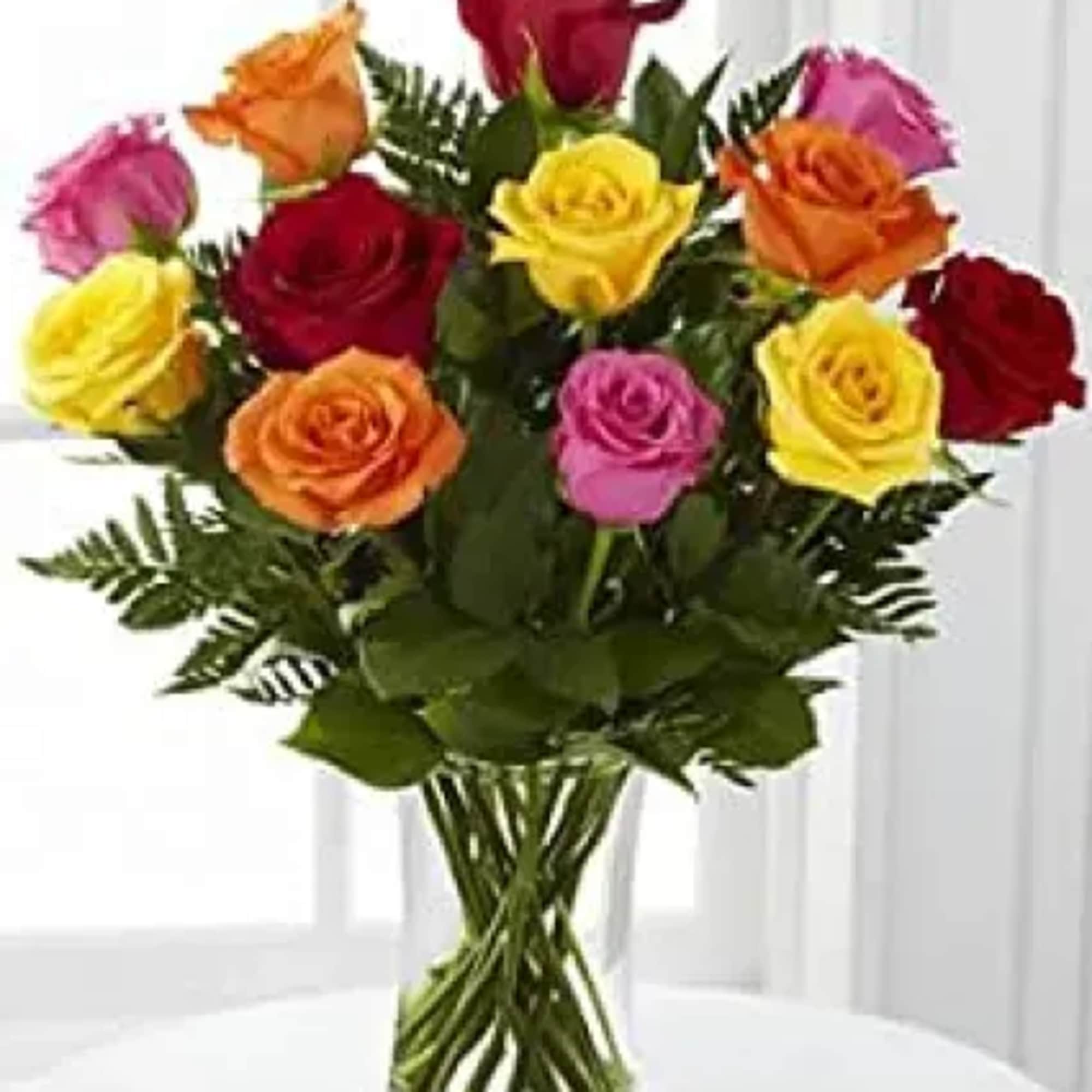 12 Mixed color roses, assorted greenery, filler flowers, bow and enclosure card.