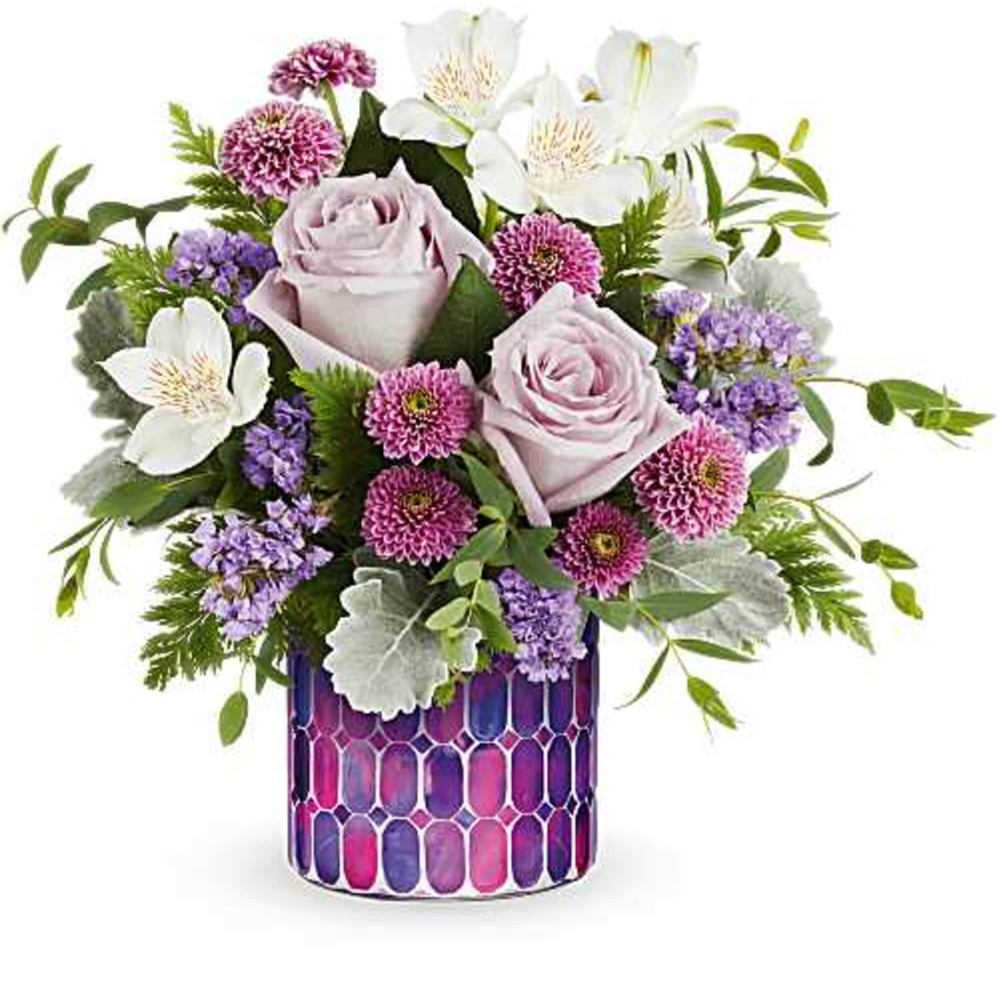 The Whimsical Lovelies Bouquet delights with soft pastel blooms arranged in our