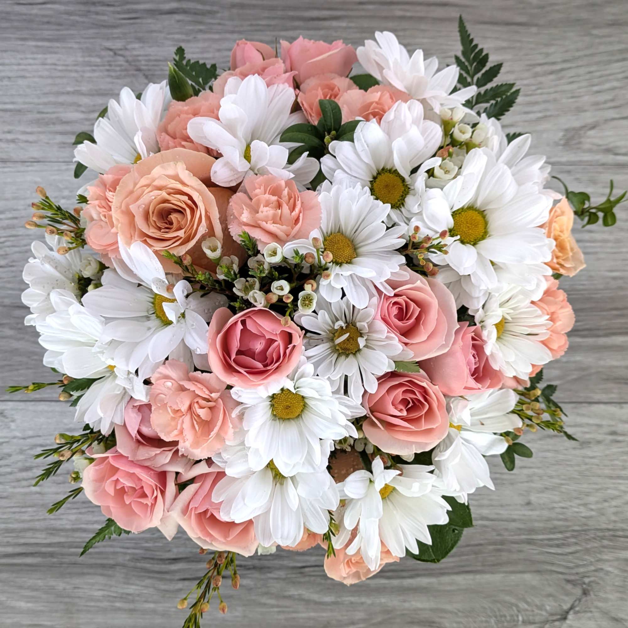 Daisy Garden is A Ladybug Floral exclusive bouquet. This bouquet features daisy