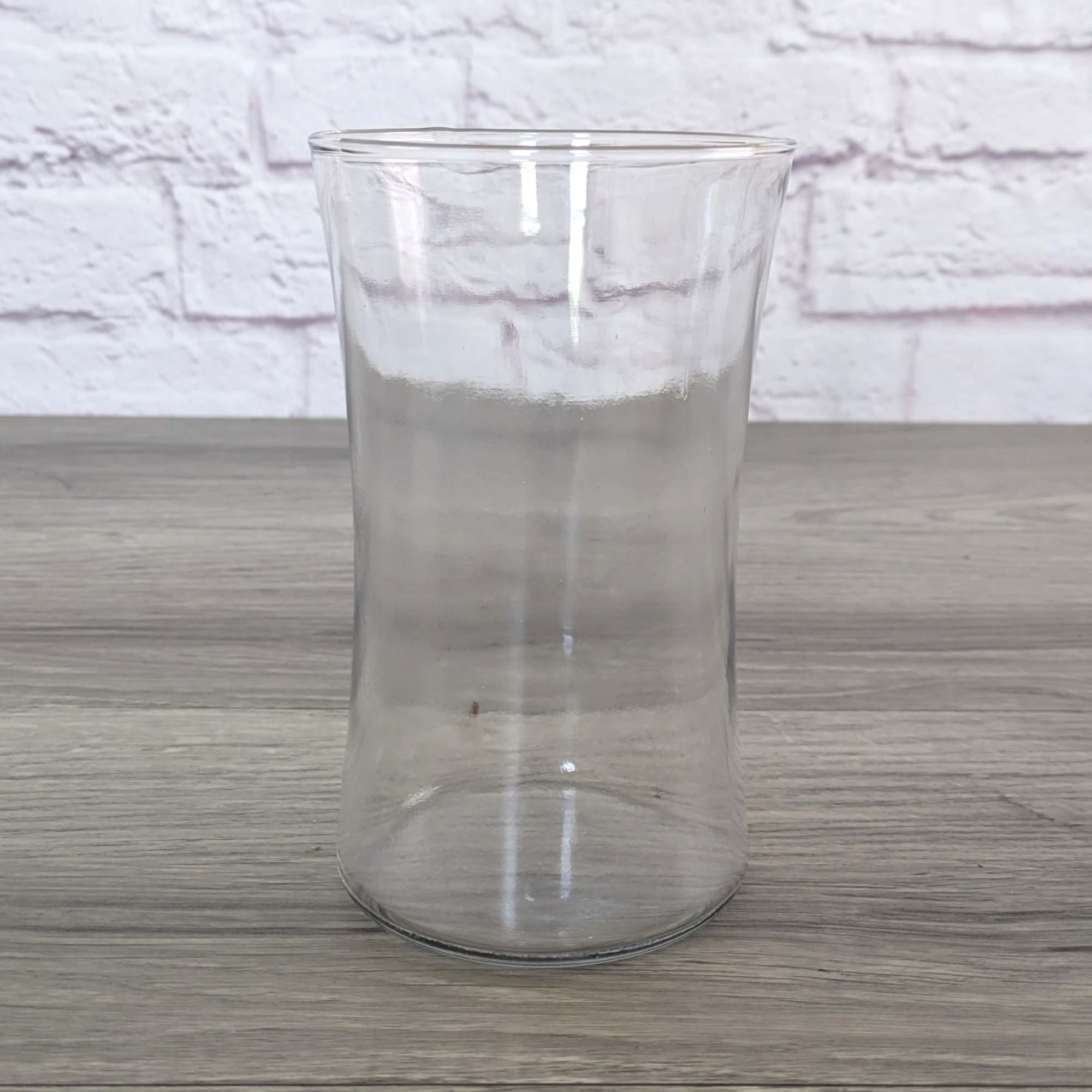 Clear glass vase on a wooden surface