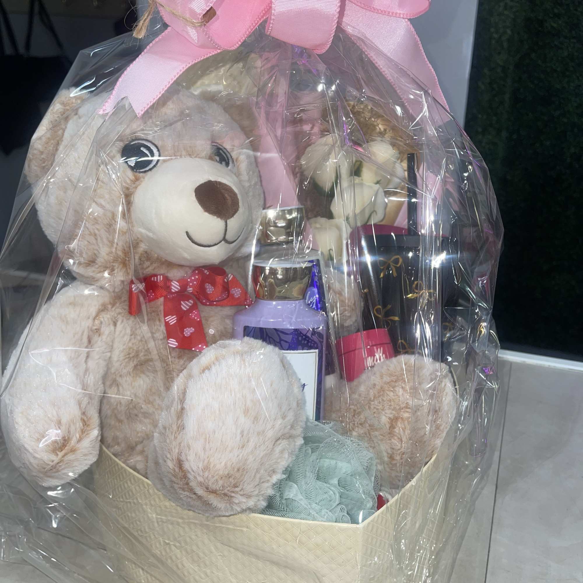 Soft pastels and a polished presentation make this gift basket the perfect