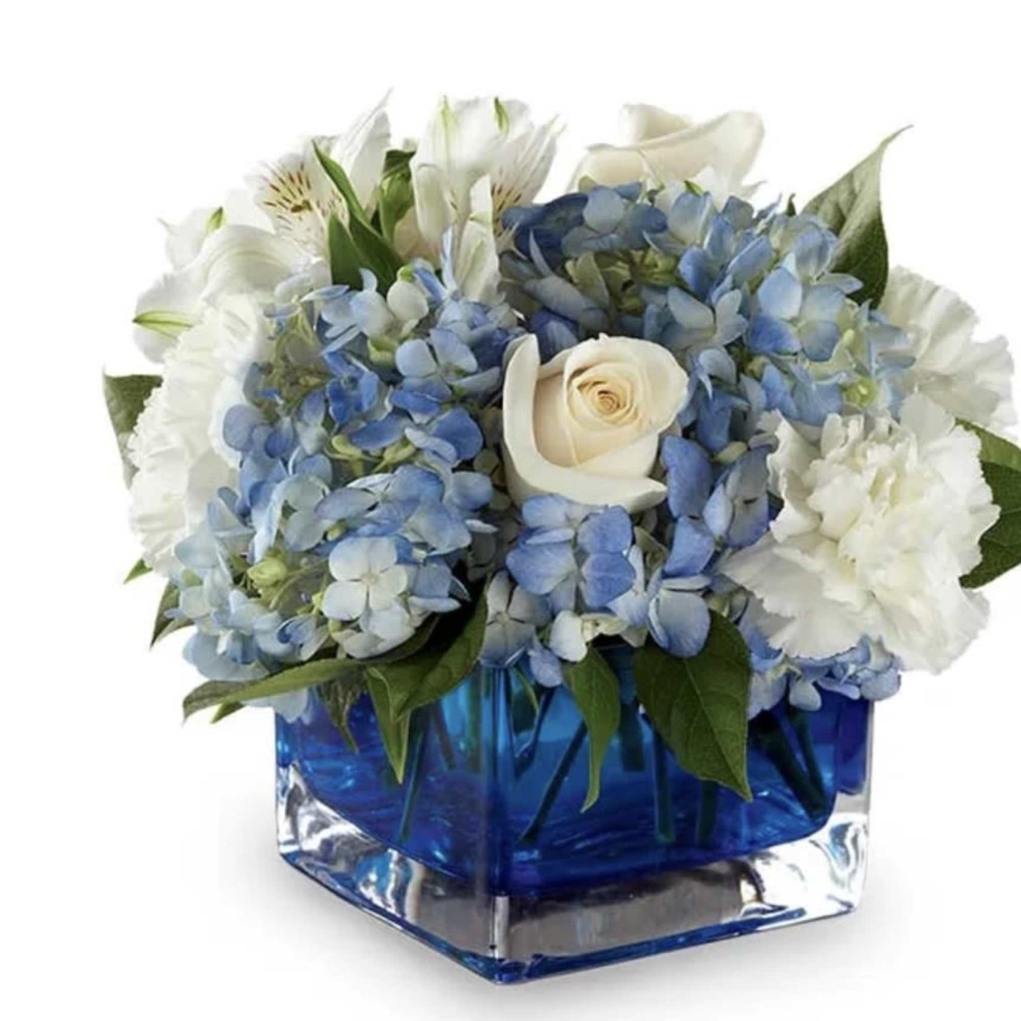 Blue and white floral arrangement in a square glass vase