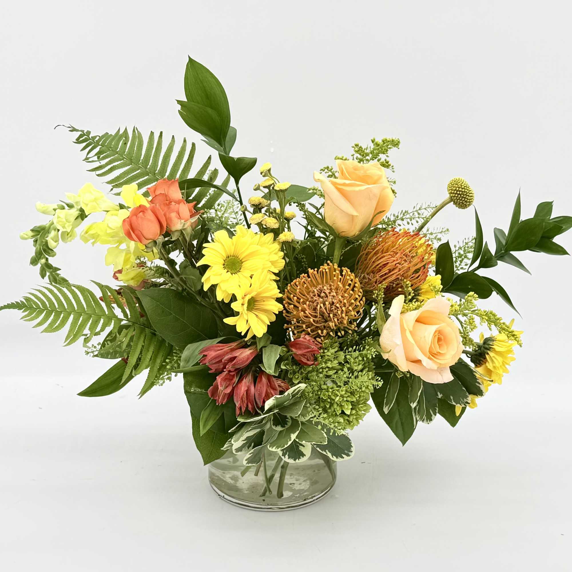 Citrus Zest is a bright, cheerful arrangement inspired by the fresh colors