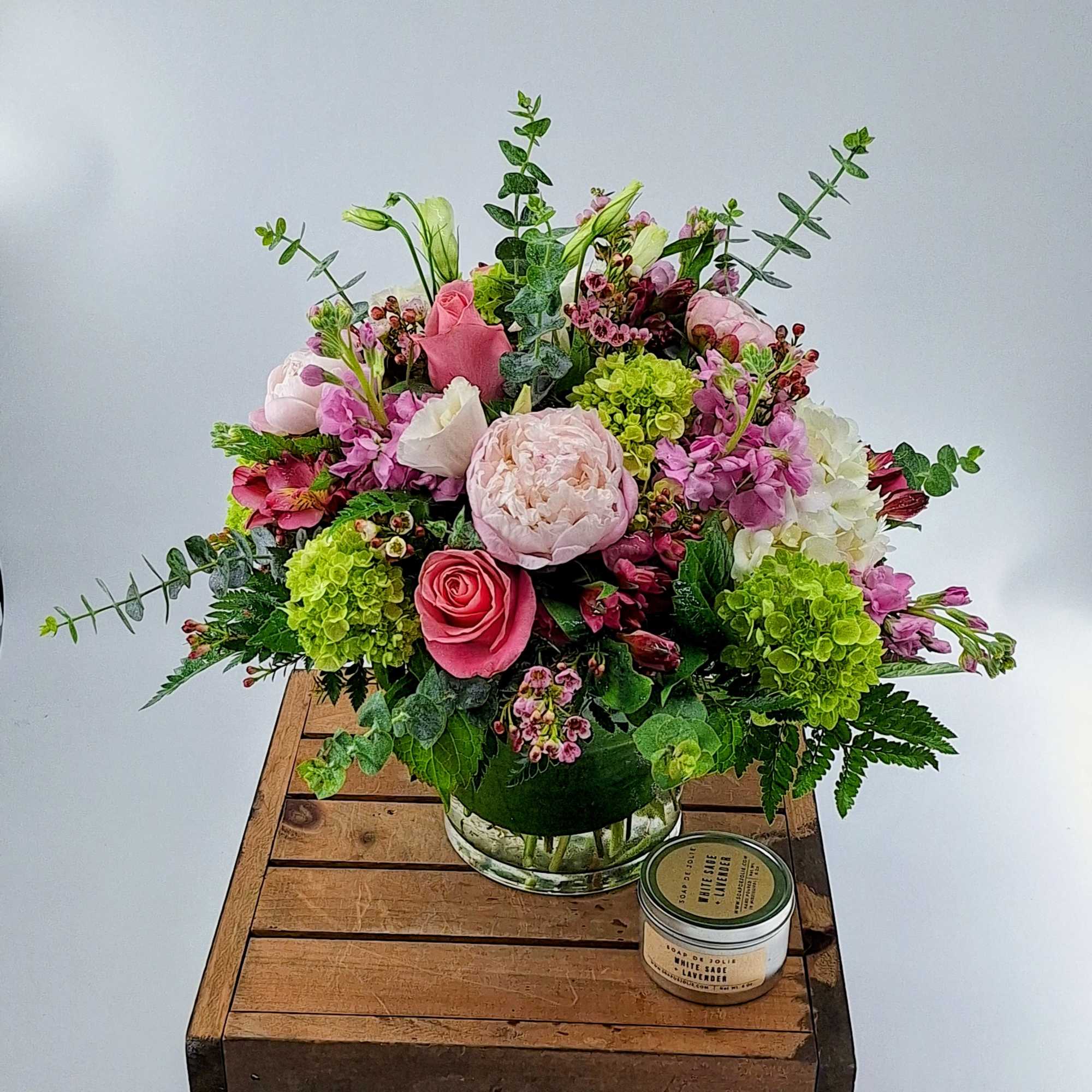 Delight in a stunning blend of green and white hydrangea, pink roses