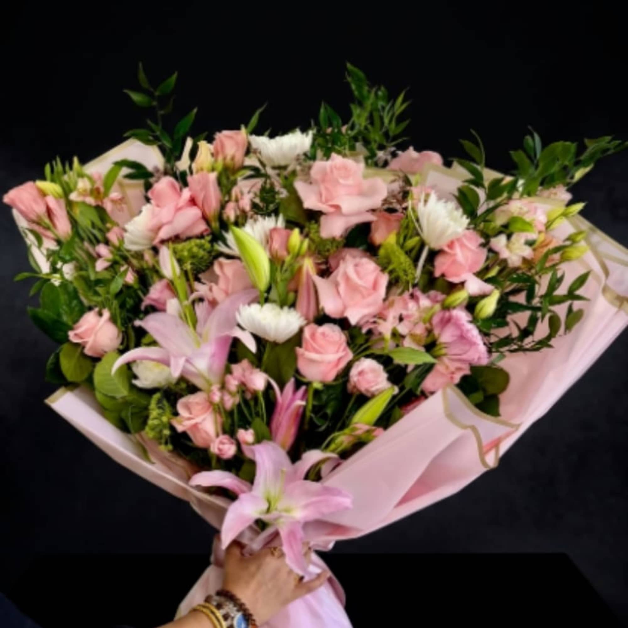 A lavish, hand-tied bouquet that reads like a love letter in soft