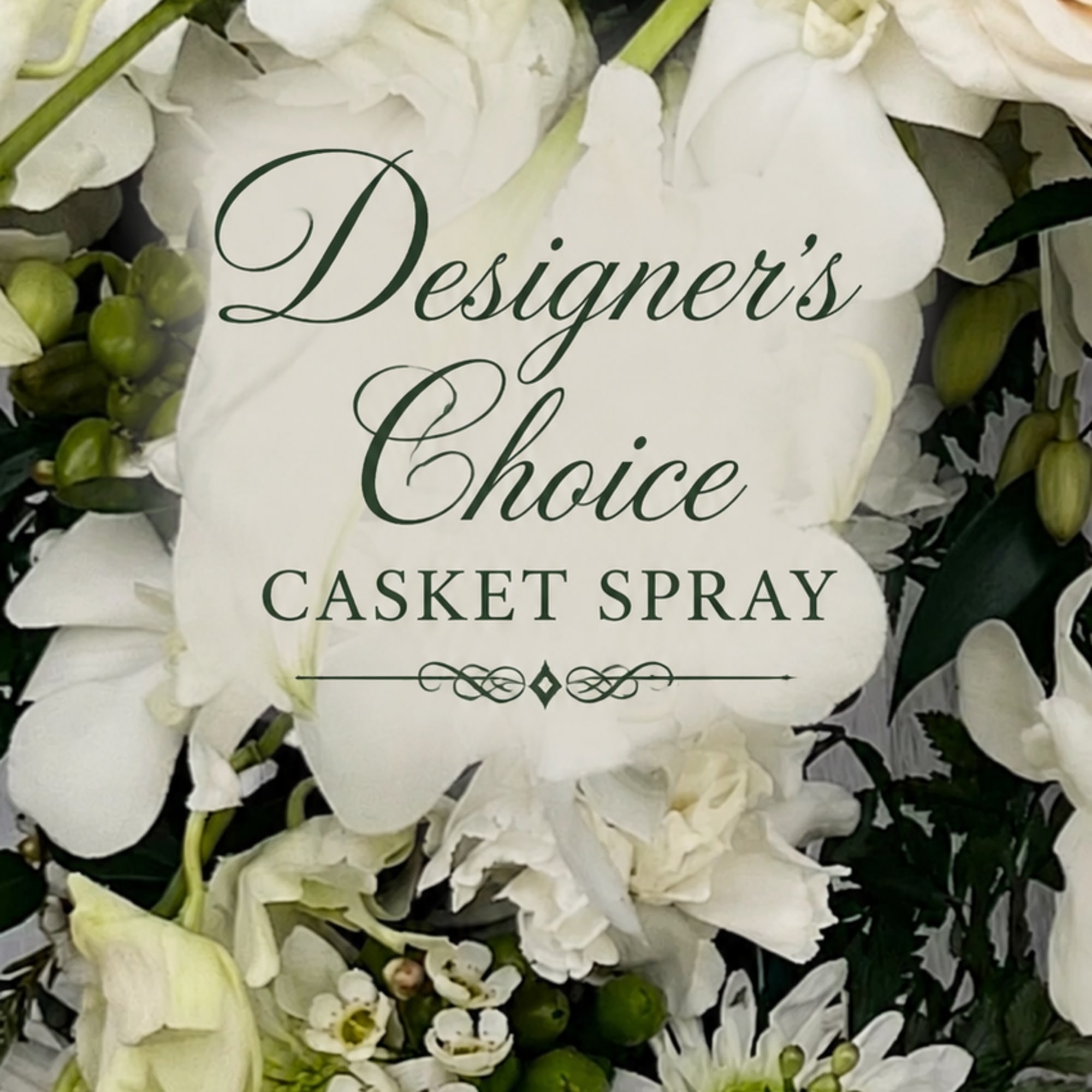 A serene, full-length casket spray of layered white blooms offers a quiet