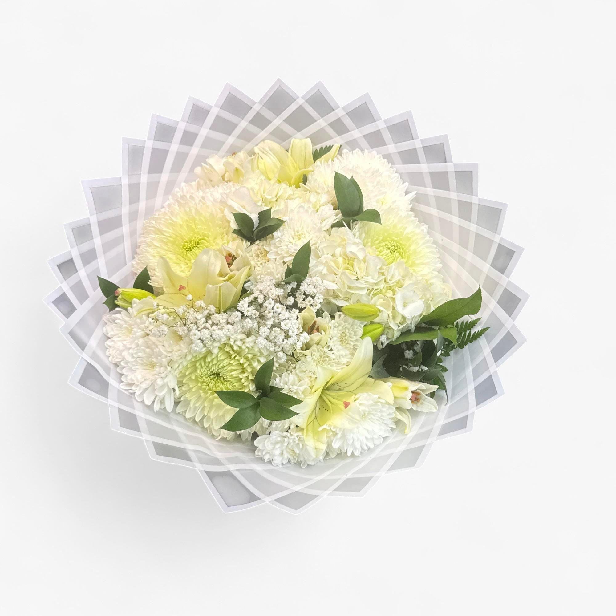 Perfect for sympathy occasions.
White flowers mixed, spiders, lillies, babybreath, greenery. White Hydrangeas
