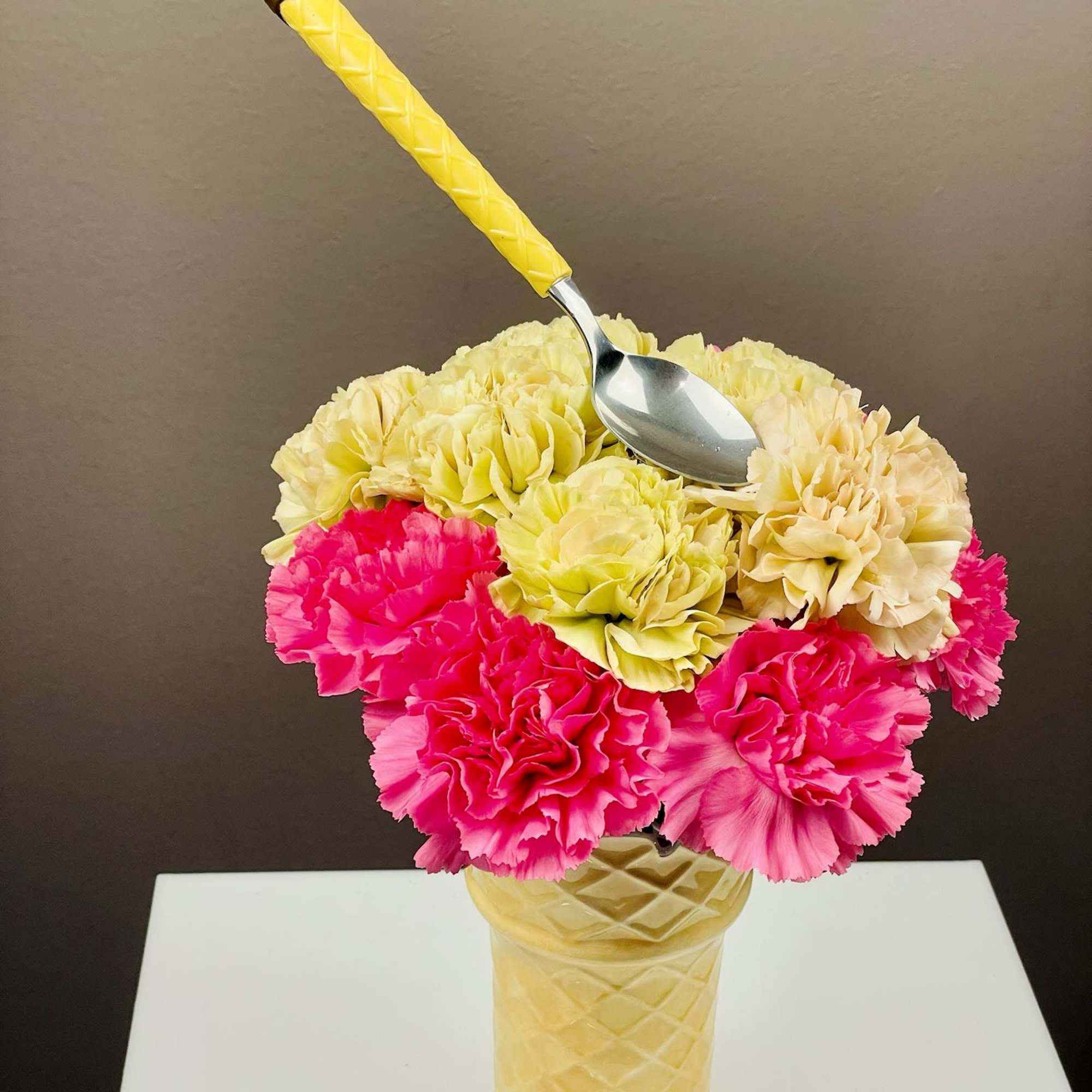 A charming, dessert‑inspired arrangement designed to look like a floral sundae. Carnations