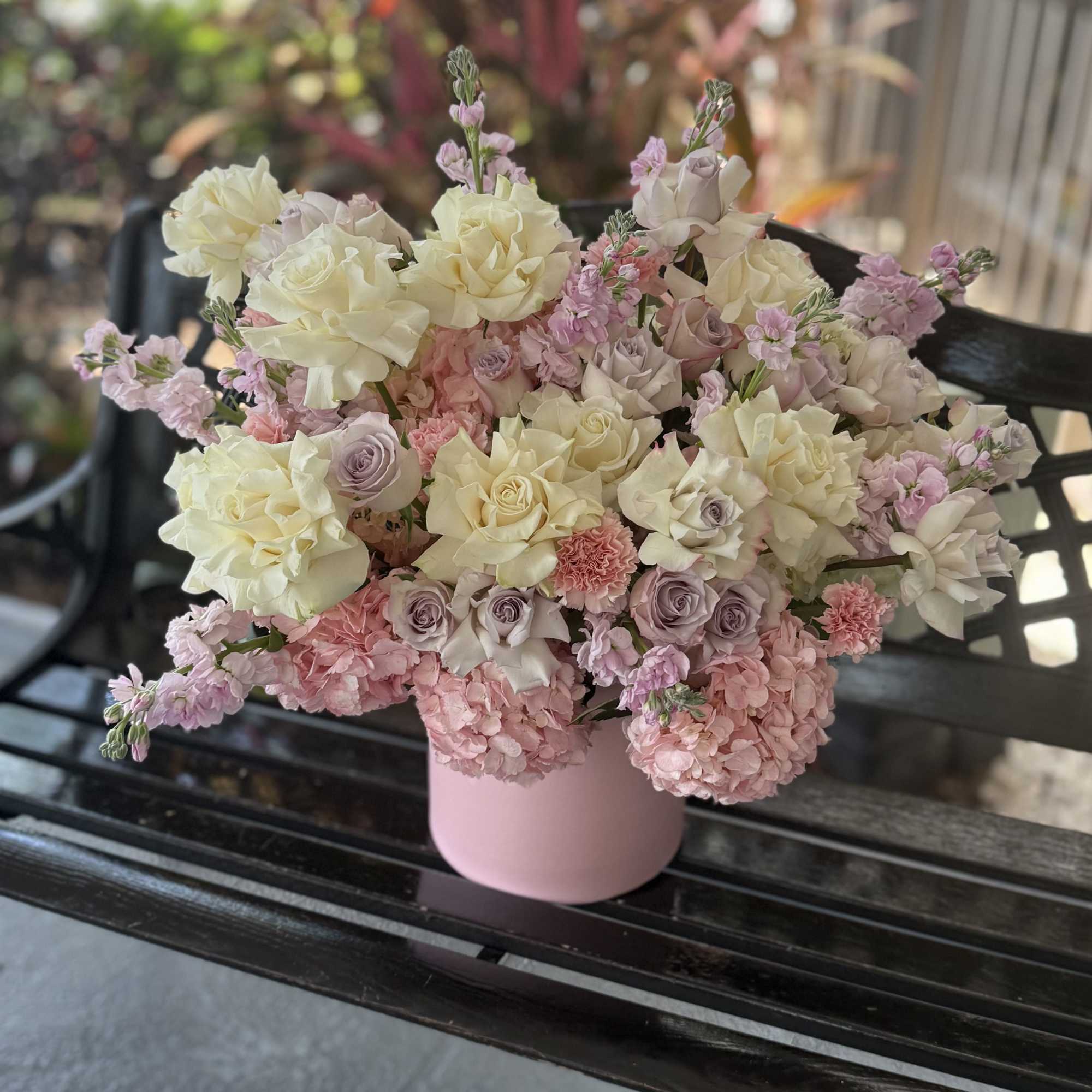 A cloud of cream, blush and lavender blooms arrives tucked into a