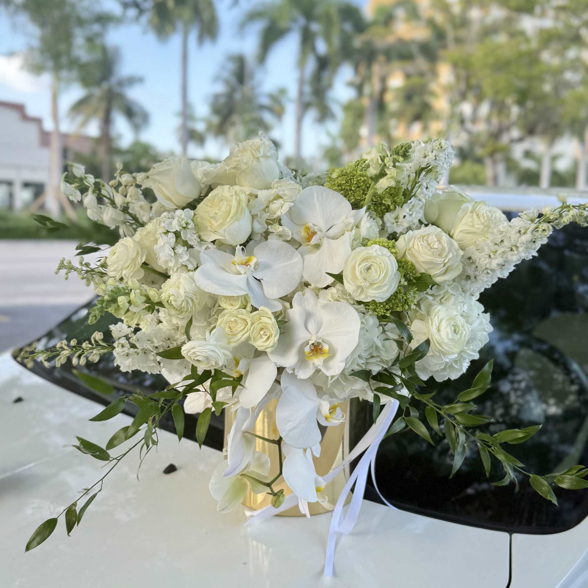 A lush, low-spread centerpiece that reads refined and romantic-perfect as a wedding
