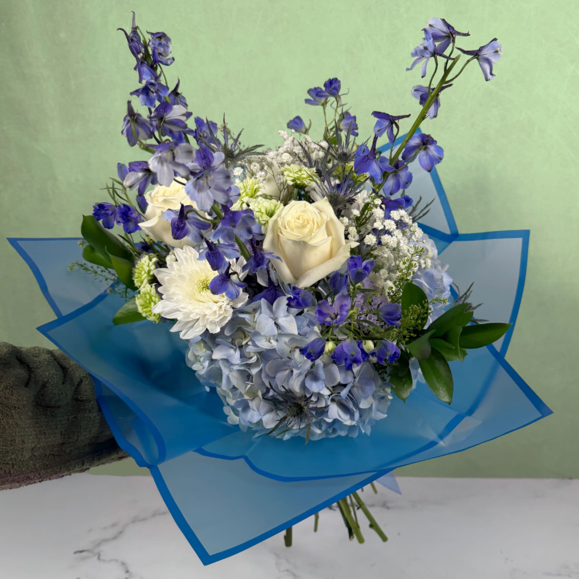 The Whispering Winds Wrapped Bouquet by Savilles Florist is a magnificent display