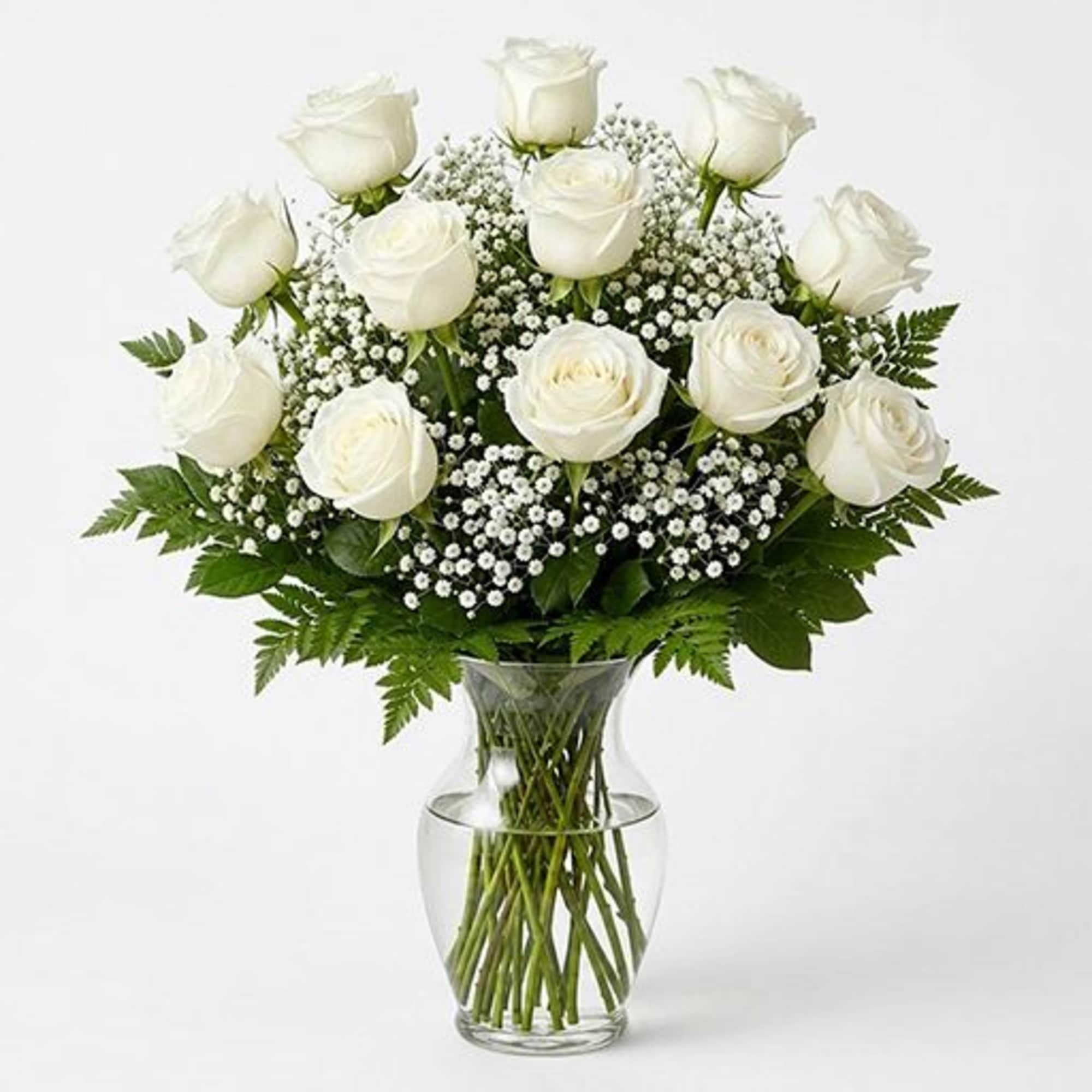 Arrangement of white roses with airy white filler, arranged in a clear