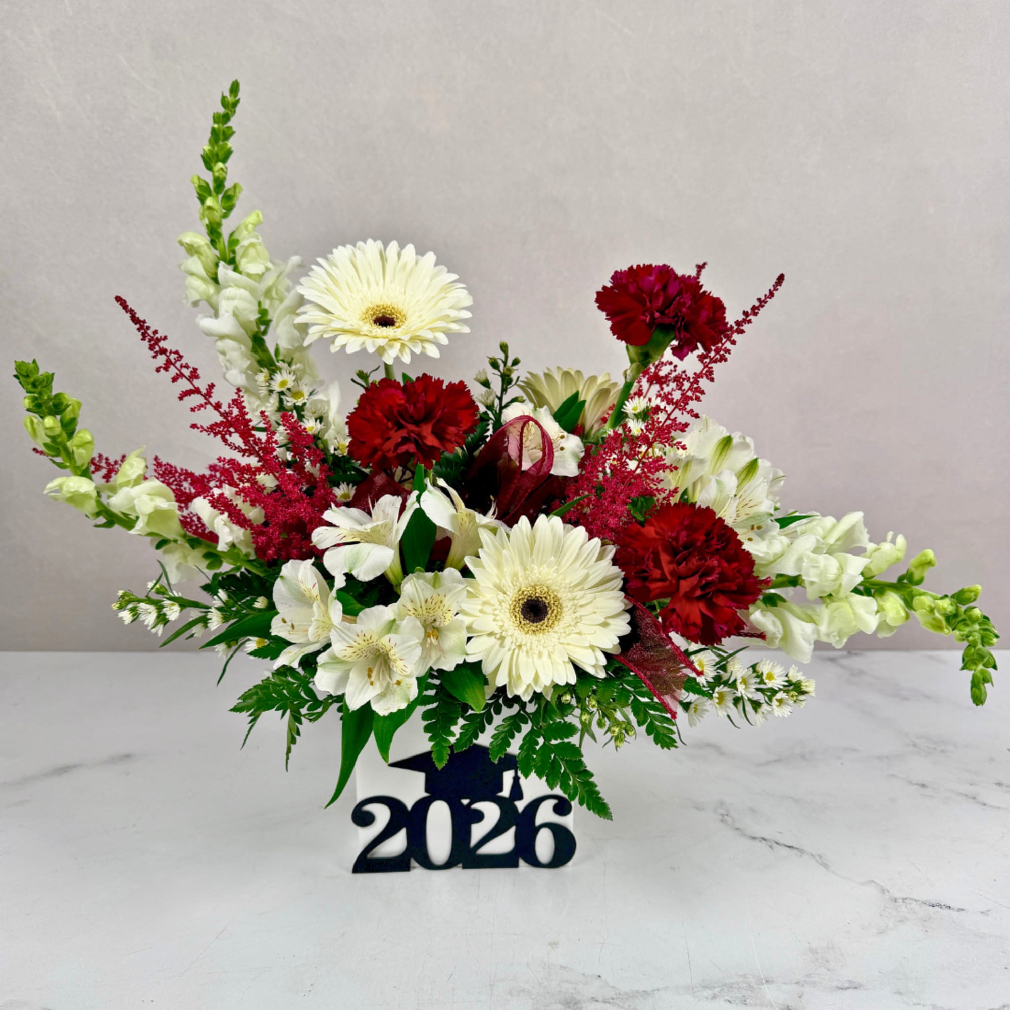 Celebrate your favorite graduate with the Sweet Success Graduation Arrangement by Savilles