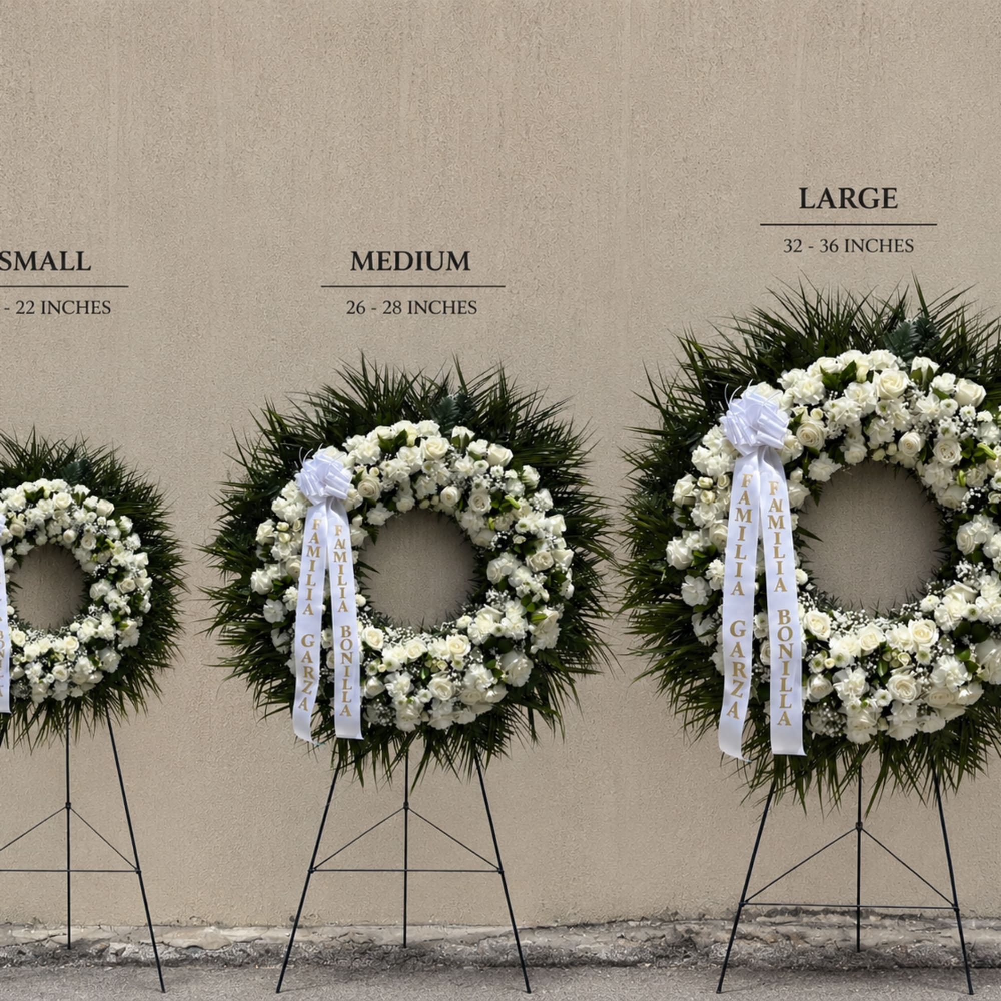 A classic white sympathy wreath that offers a quiet, dignified tribute for