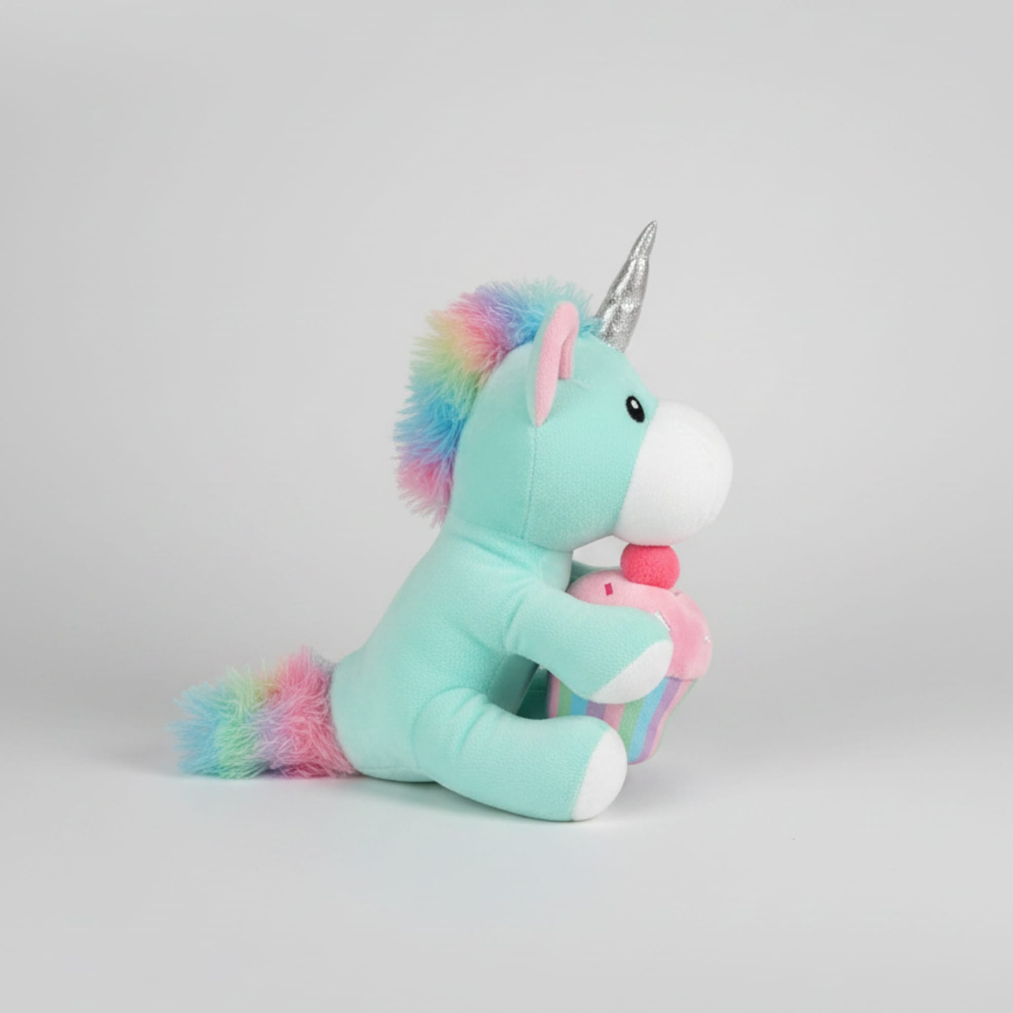 Pastel green musical unicorn plush makes a whimsical birthday gift for kids