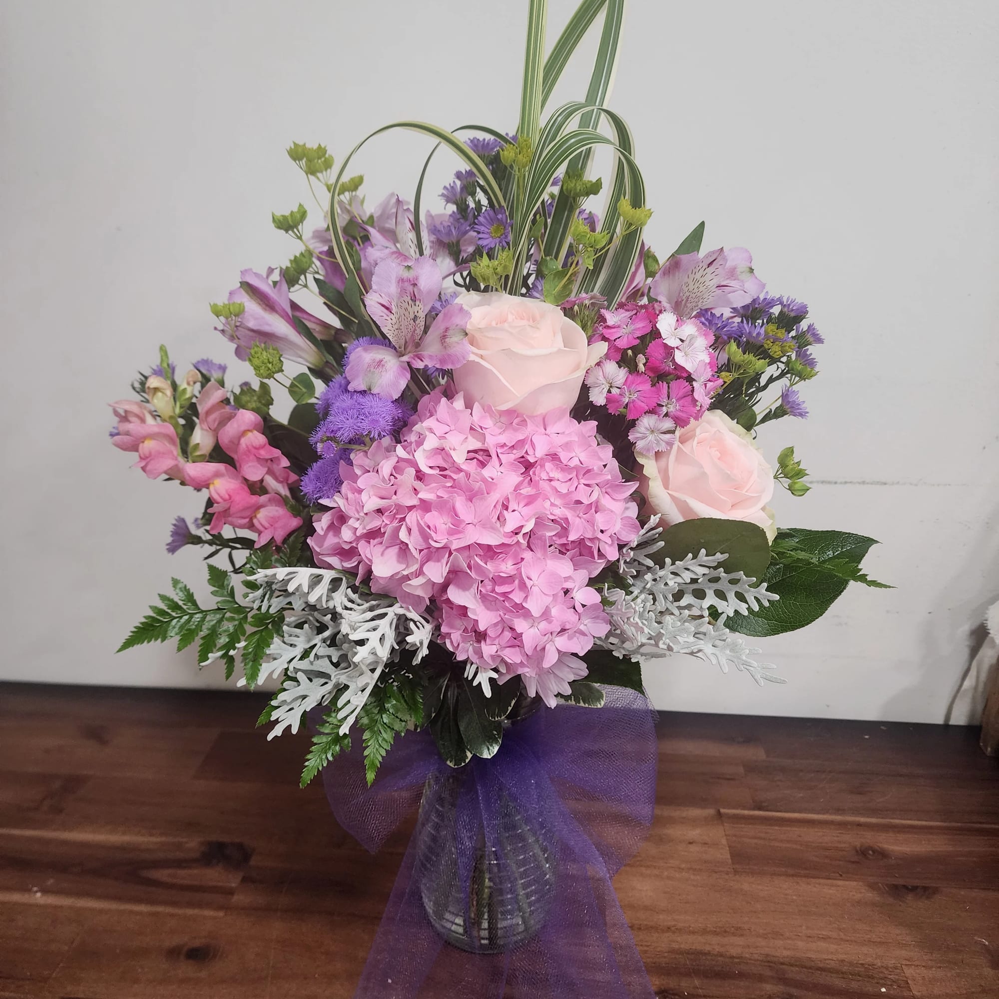 Designed in a vase with hydrangea, alstroemeria, roses and other accent flowers.
