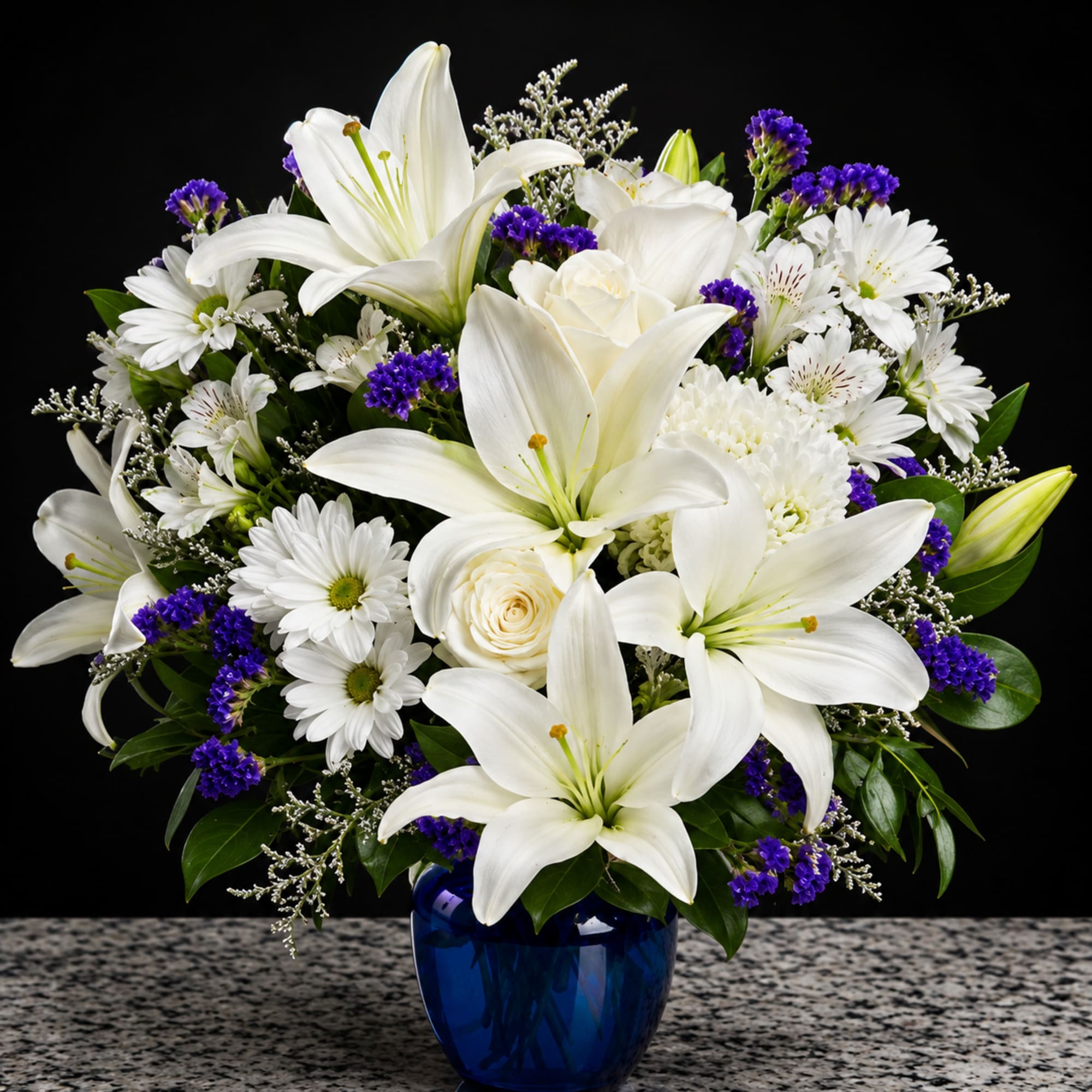 Big, luminous white lilies take center stage in this elegant flower arrangement