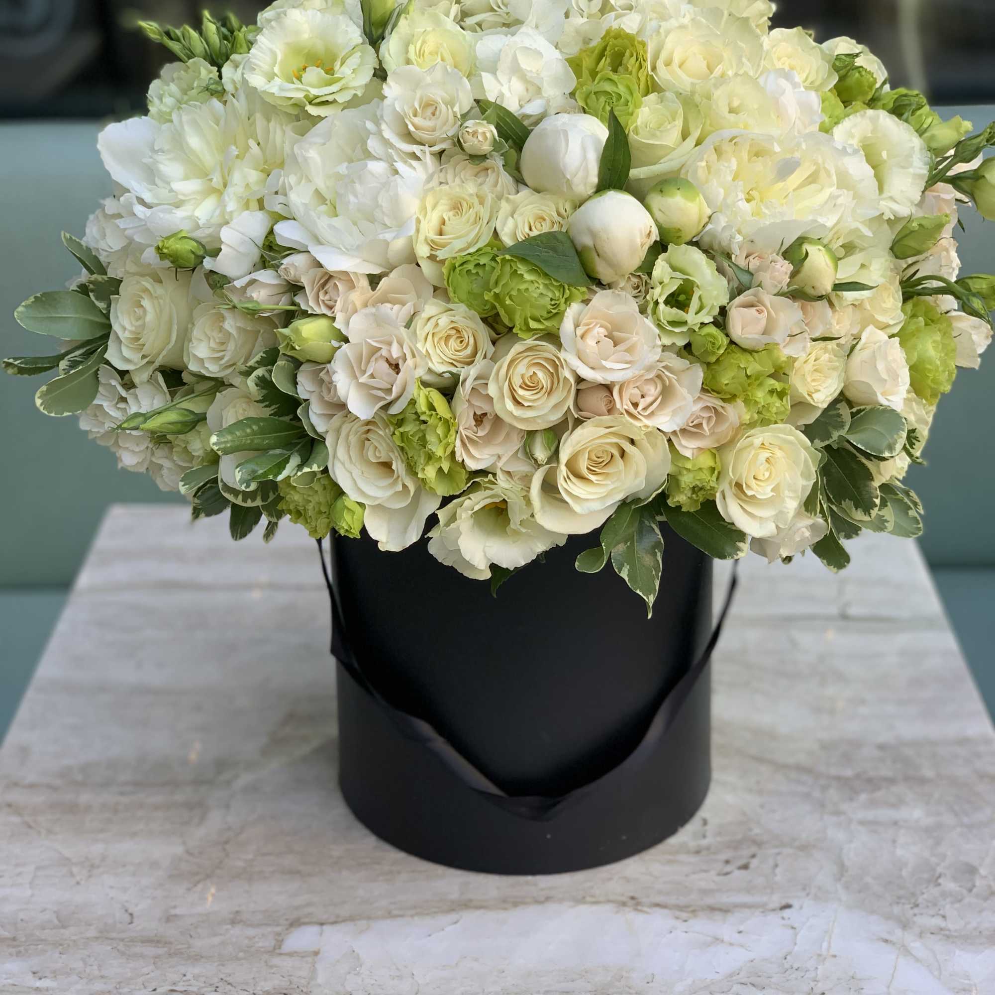 A truly stylish and elegant white &amp; green flower arrangement designed in