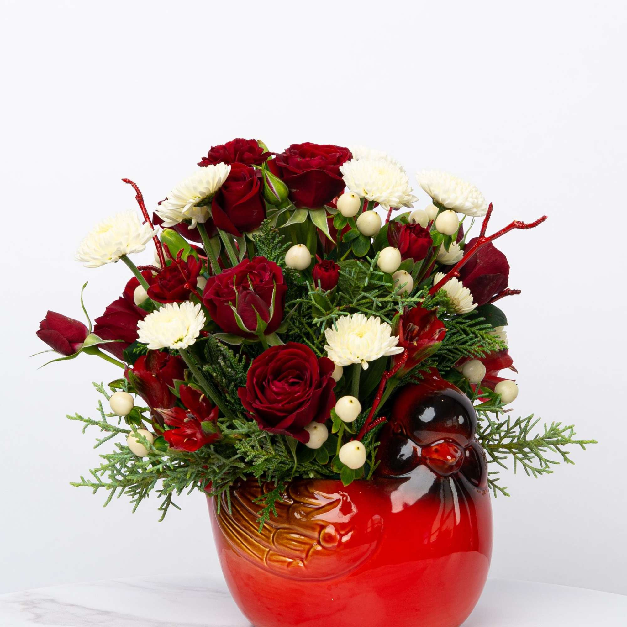Our Honor Collection's Cheerful Cardinal arrangement is designed with rich, patriotic hues
