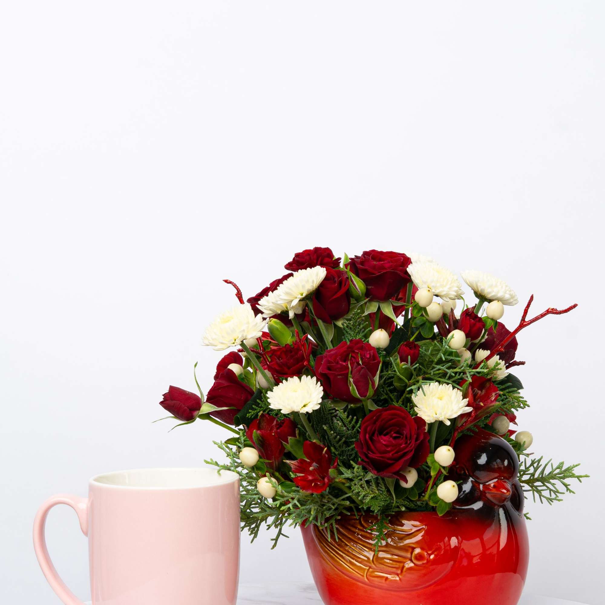 Our Honor Collection's Cheerful Cardinal arrangement is designed with rich, patriotic hues