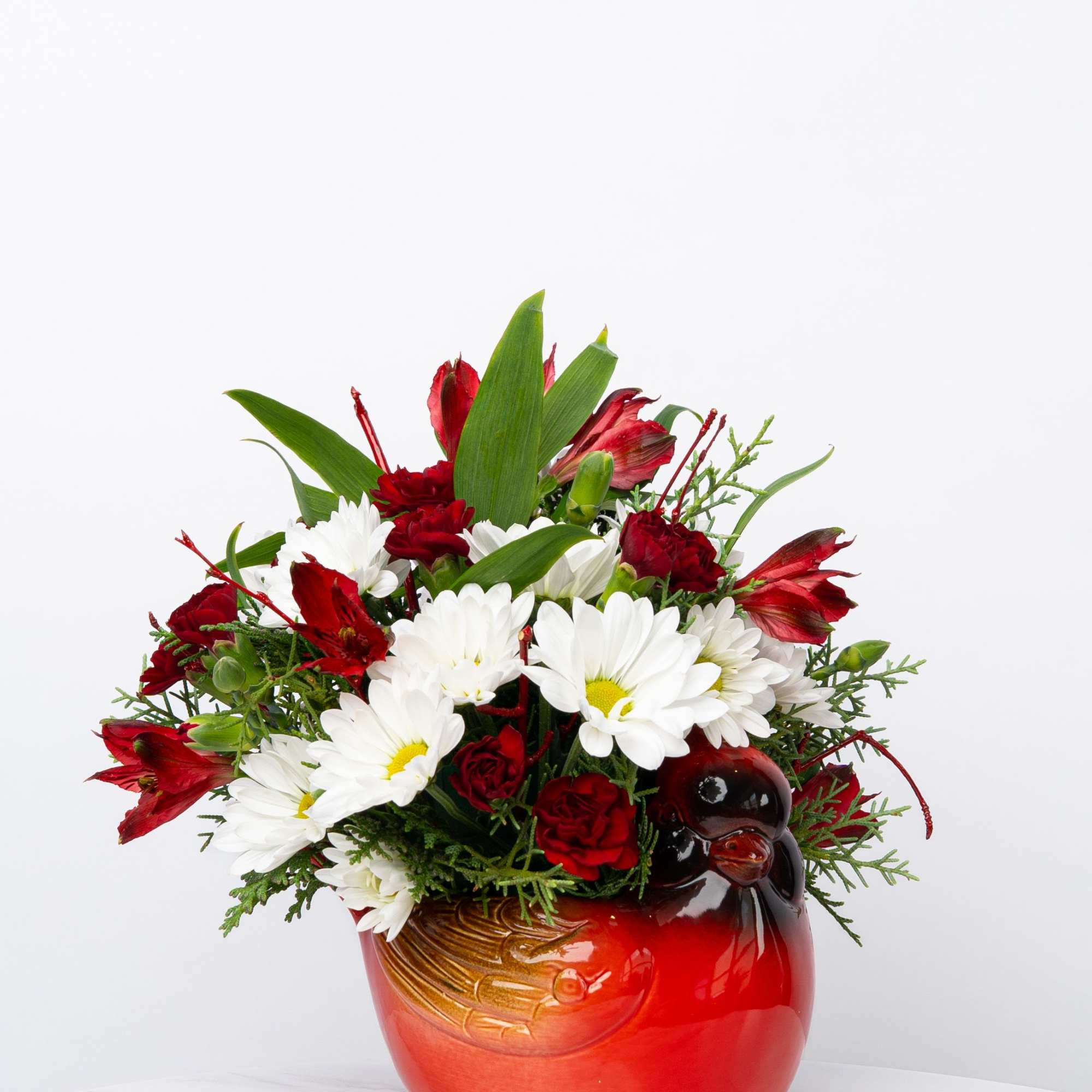 Our Honor Collection's Cheerful Cardinal arrangement is designed with rich, patriotic hues