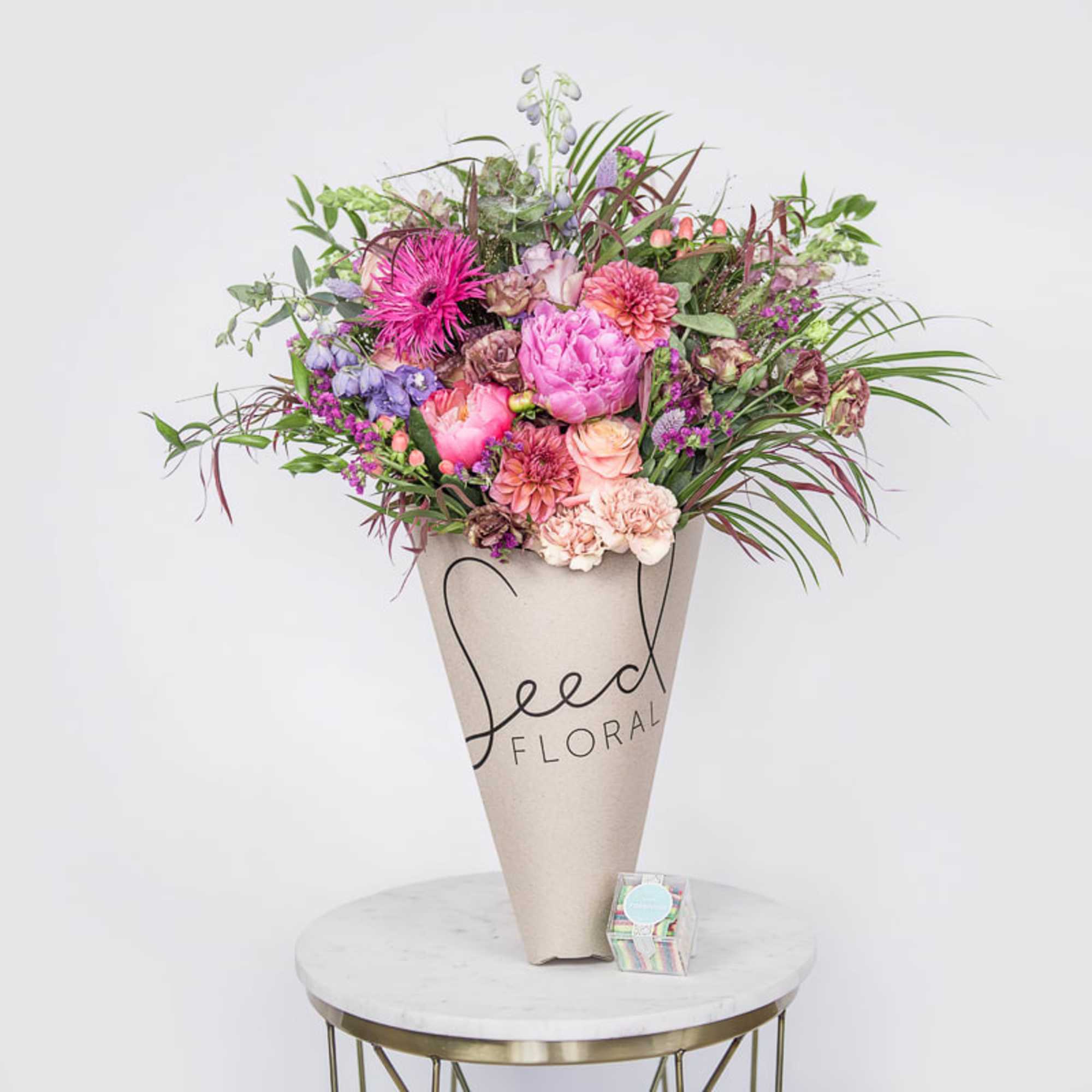 A lush, hand-tied summer bouquet that bursts with joyful color-perfect as an