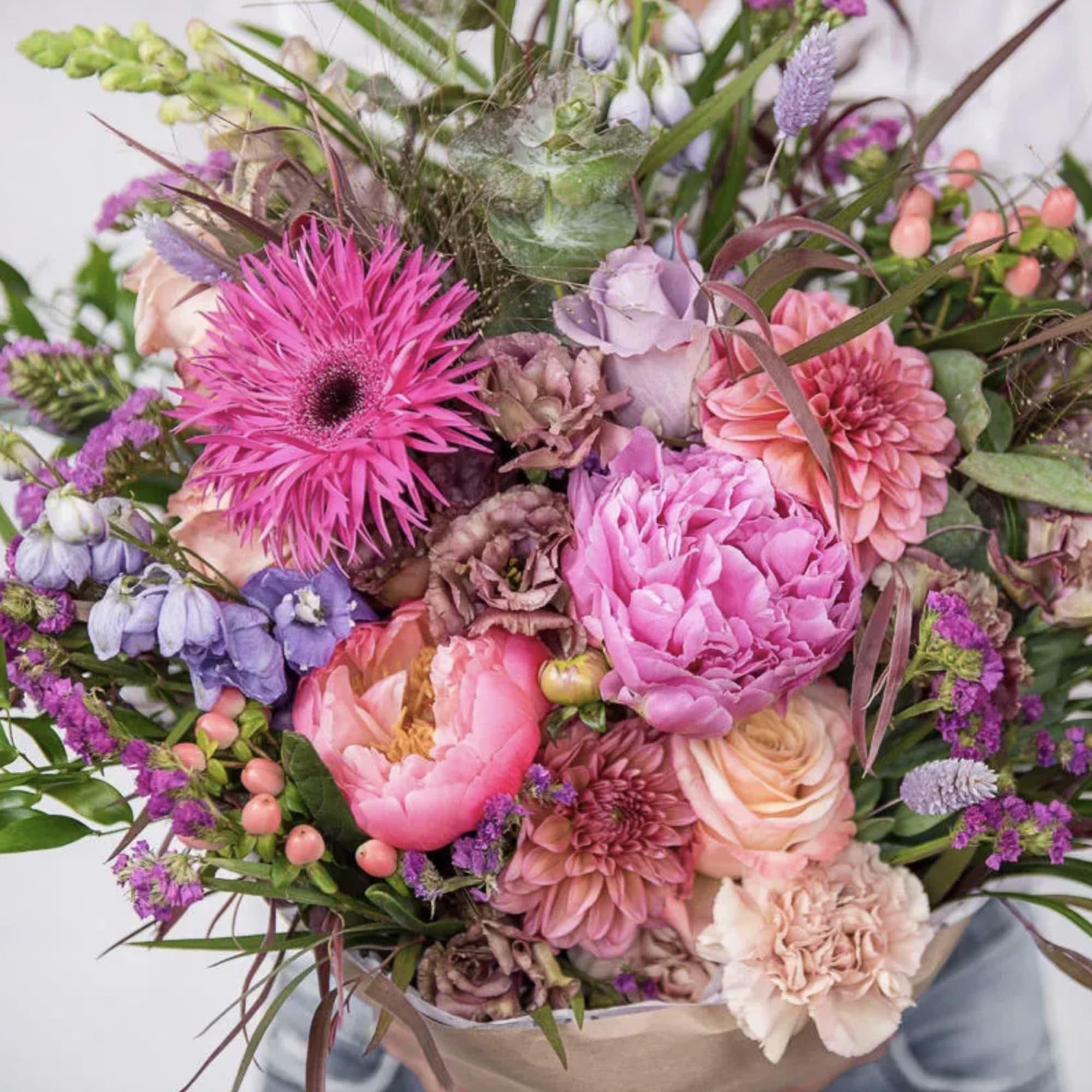 A lush, hand-tied summer bouquet that bursts with joyful color-perfect as an