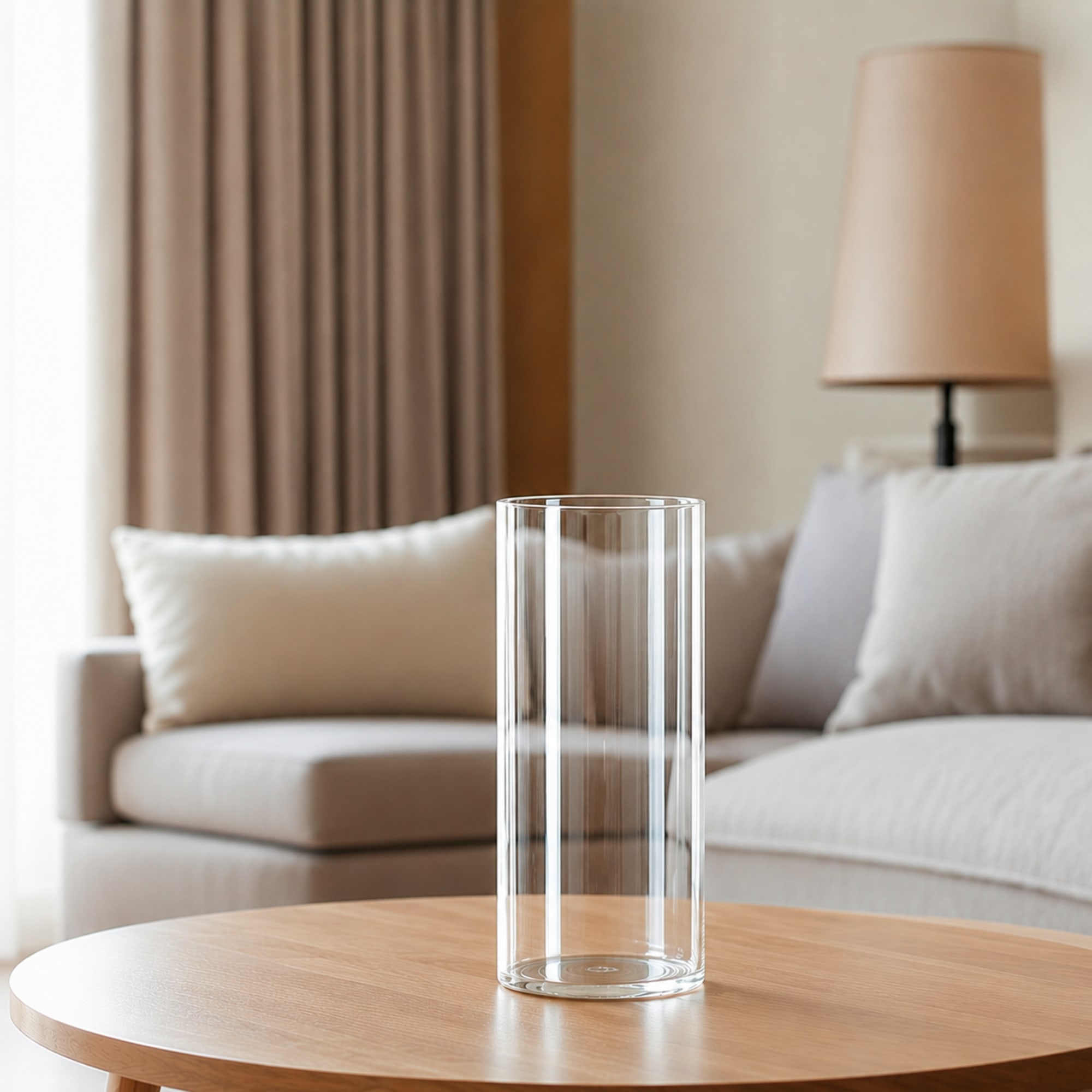 A clear cylindrical glass vase that keeps the flowers front and center