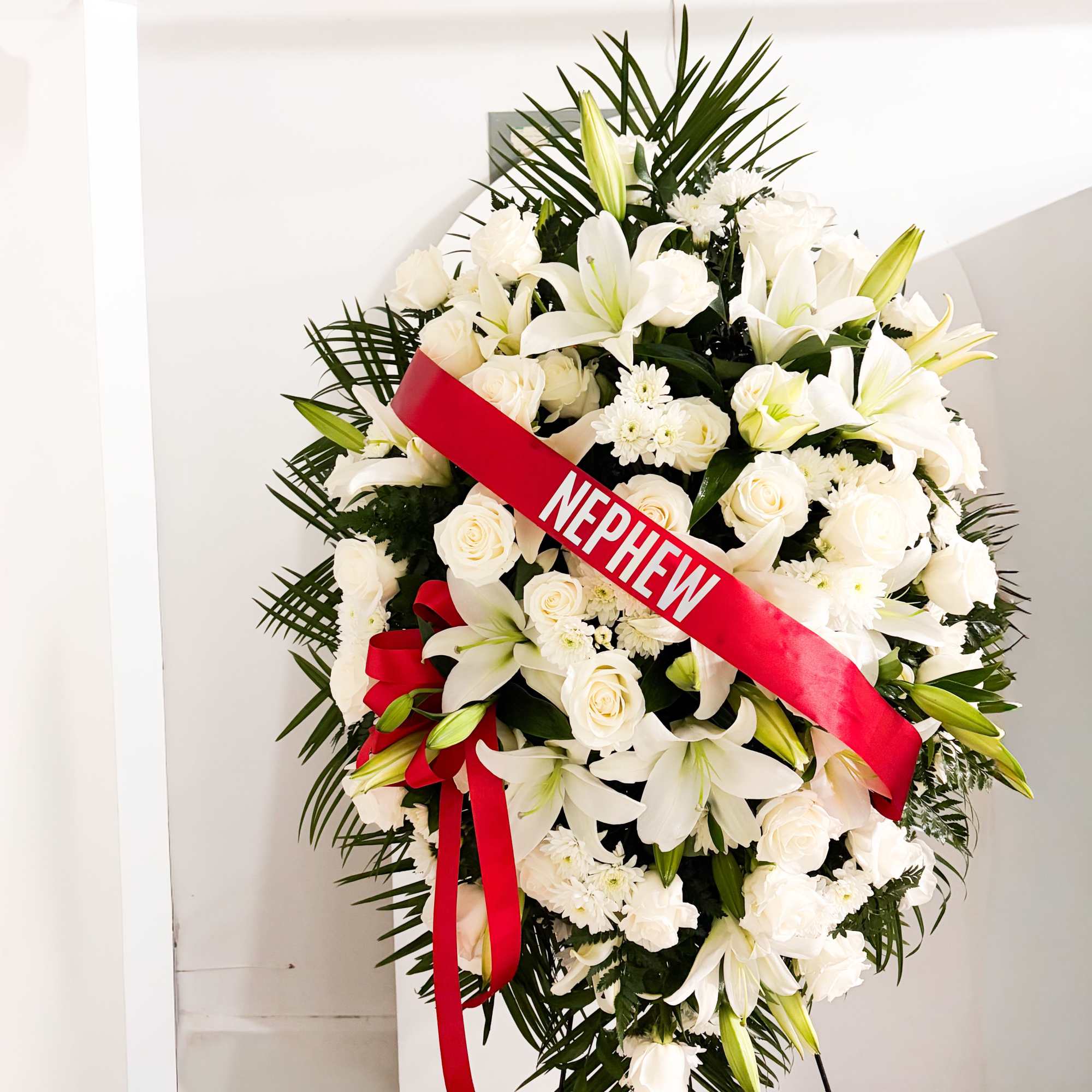 Introducing our Exquisite Tribute Standing Spray, a beautifully designed floral arrangement that