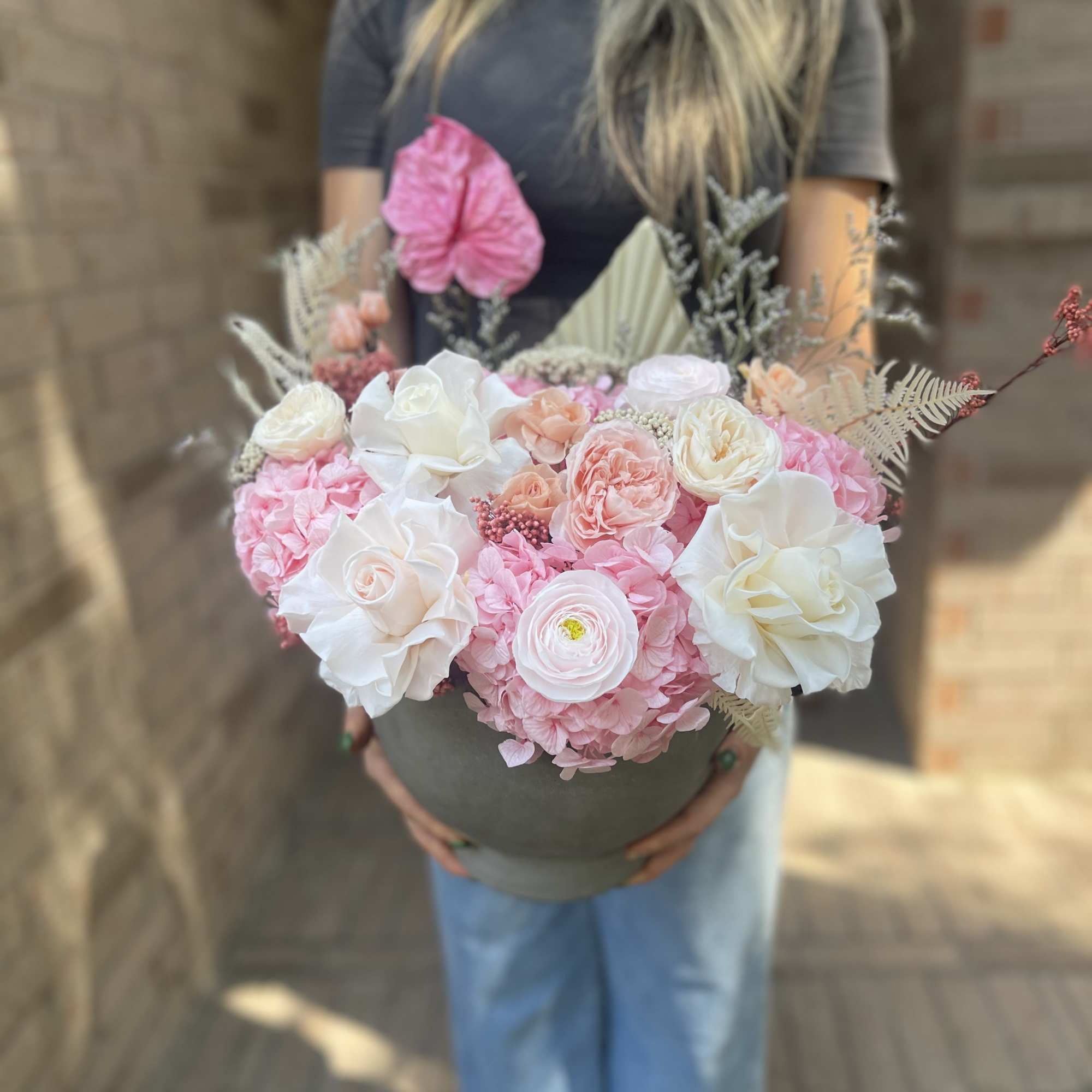 Large pink and white bouquet in a round box