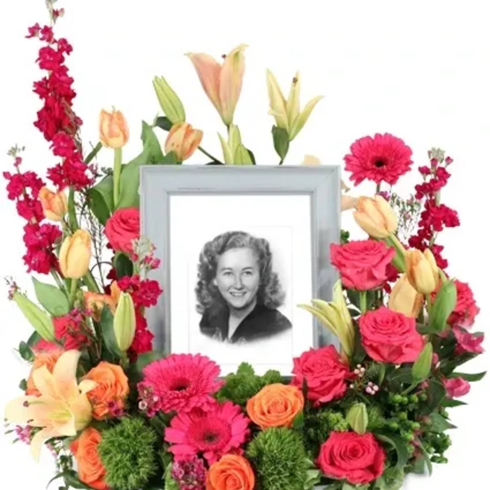 Consoling Embrace is a stunning memorial arrangement brimming with hot pink roses