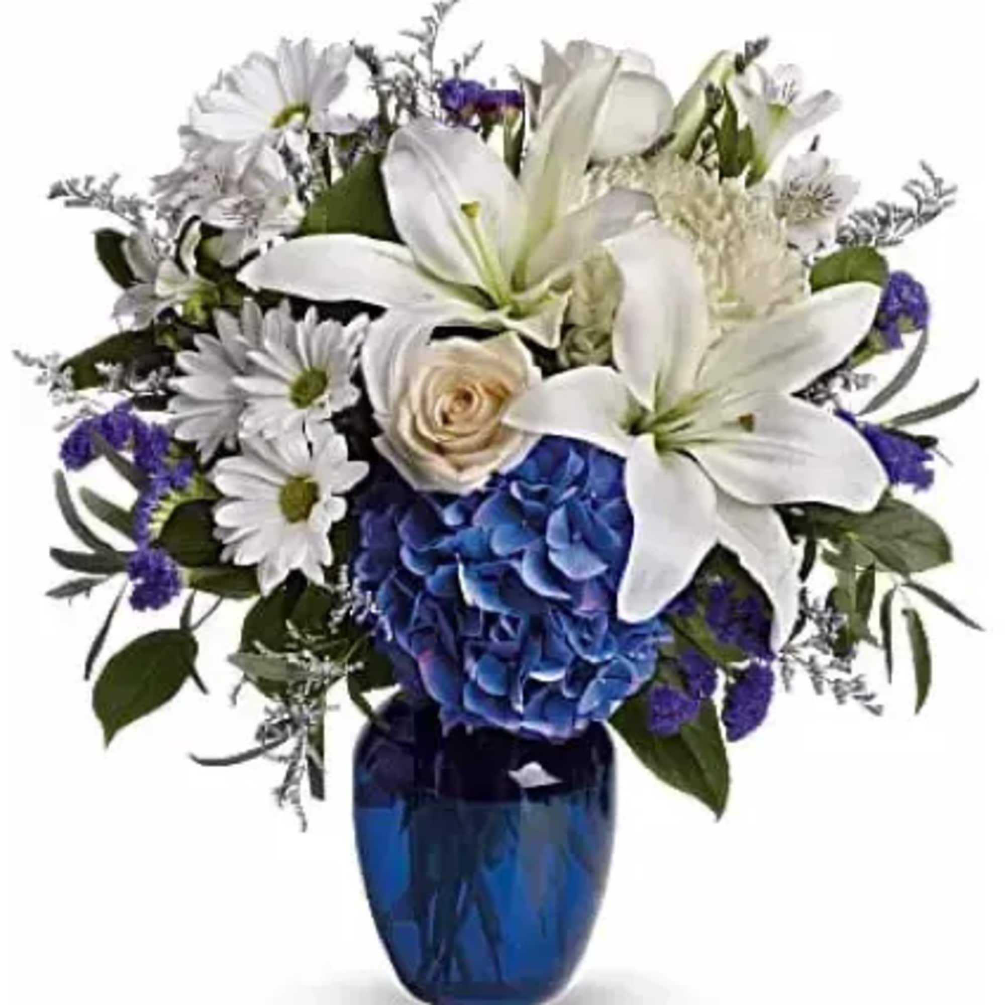 Blooms such as blue hydrangea, cr&egrave;me roses, graceful white oriental lilies, white