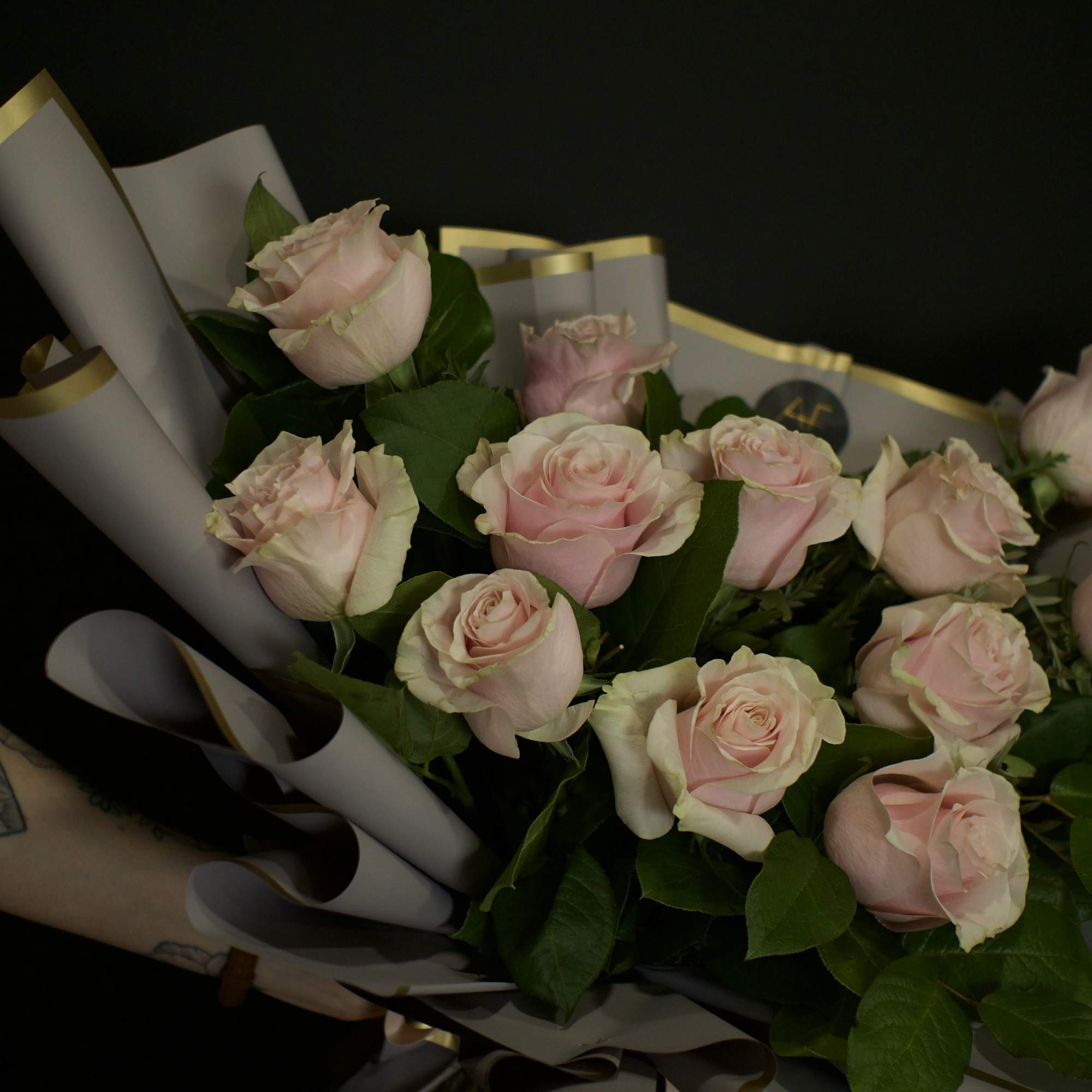 A contemporary bouquet of stunning light pink roses, thoughtfully designed with a