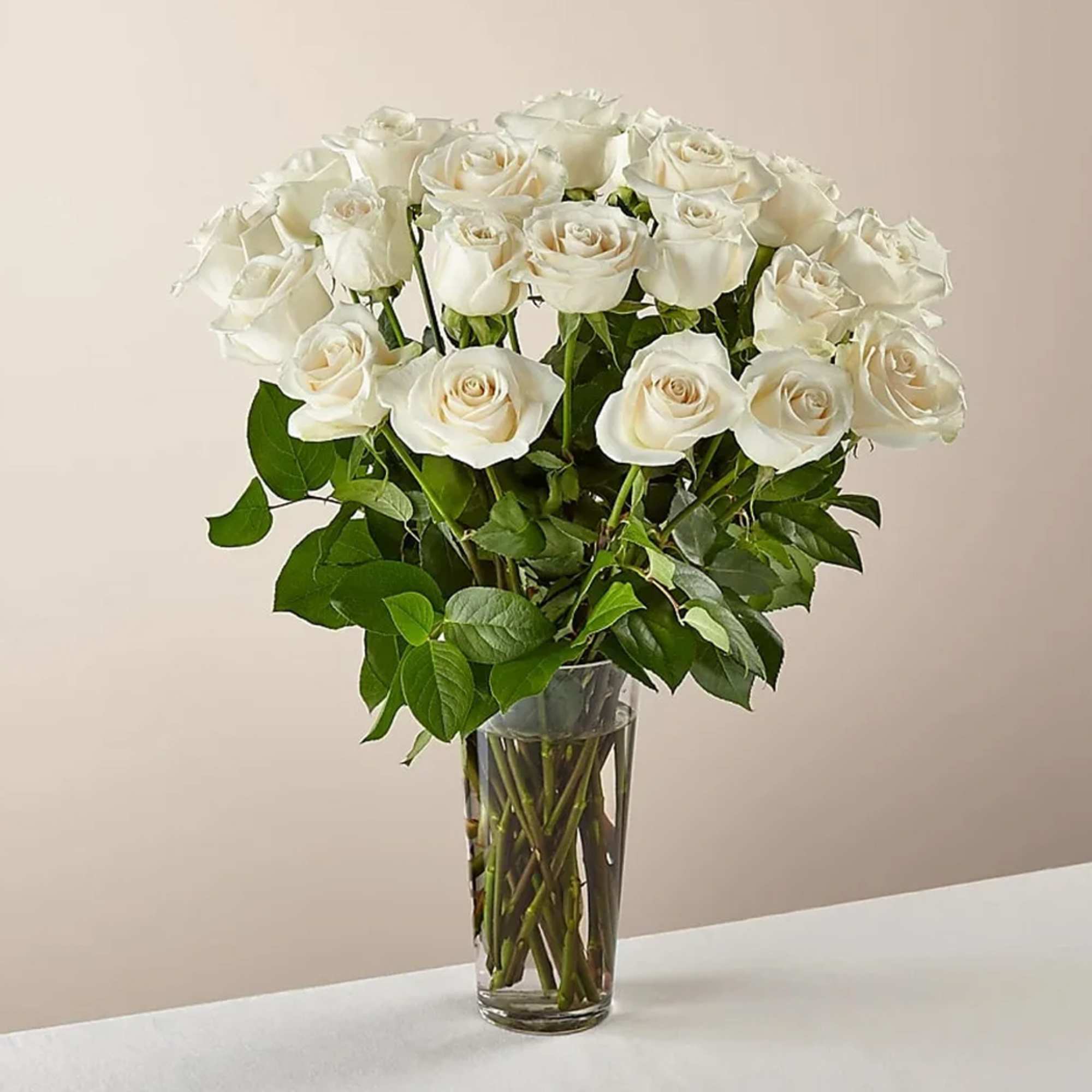 Bouquet of white roses in a clear glass vase