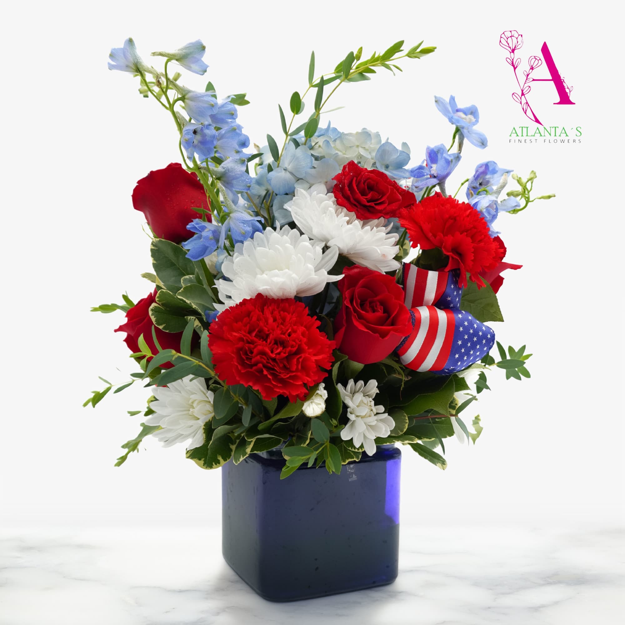 Celebrate Independence Day with this festive arrangement featuring radiant red roses and