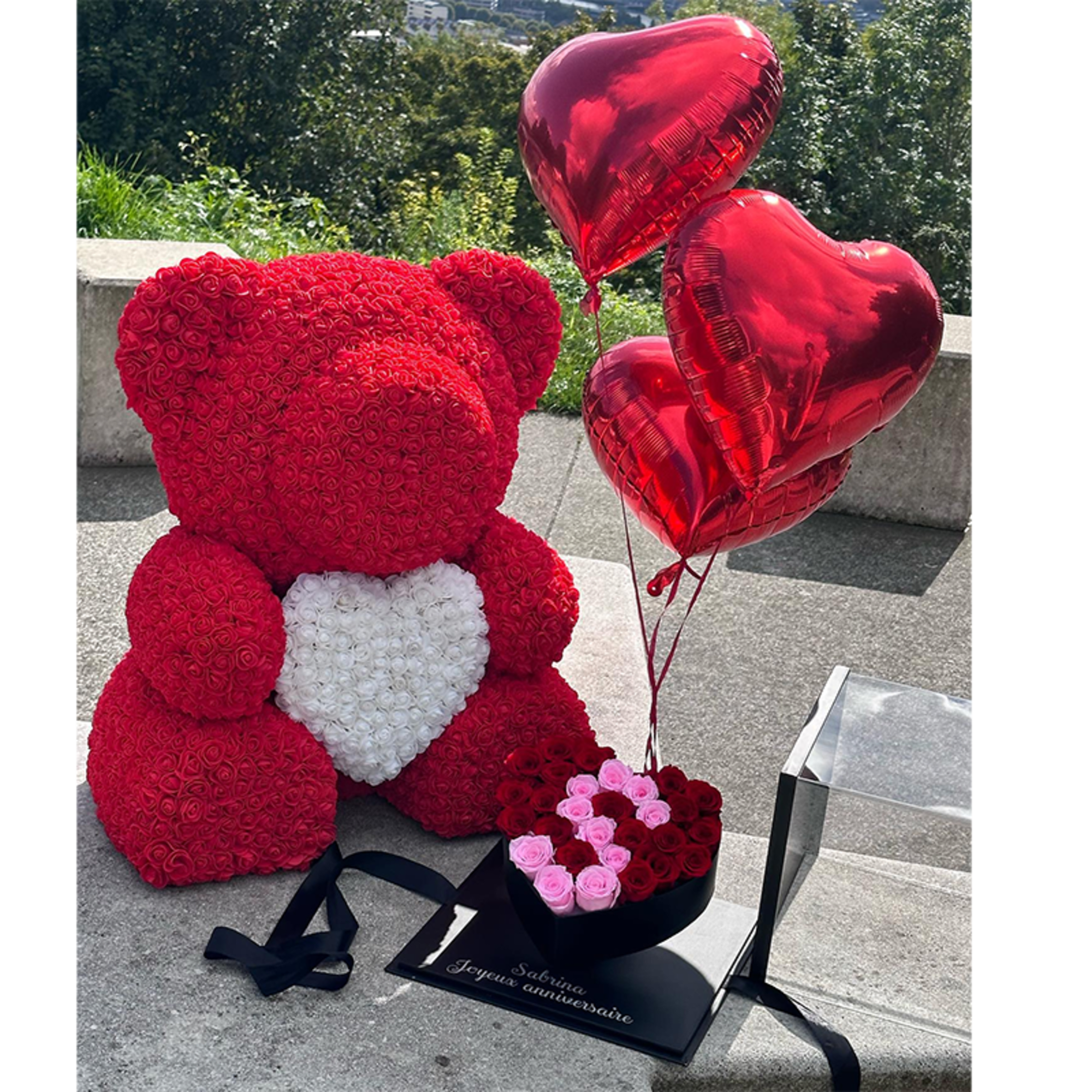 Red rose teddy bear with heart balloons and a small heart-shaped rose box