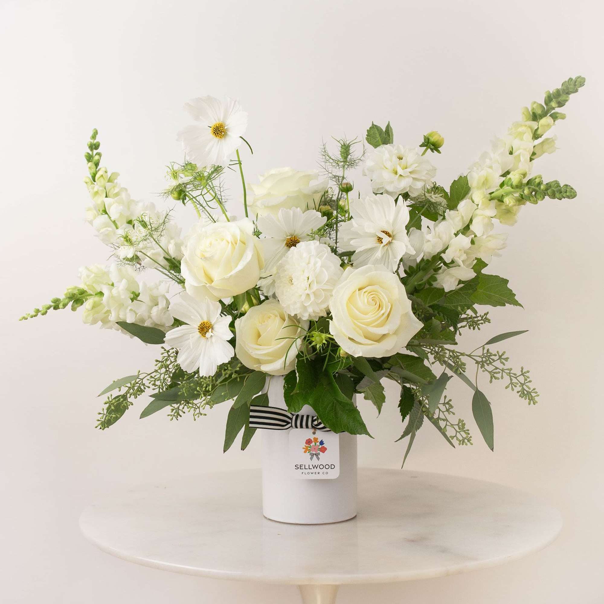 A stunning white bouquet that evokes simplicity, calmness, and peace. This arrangement
